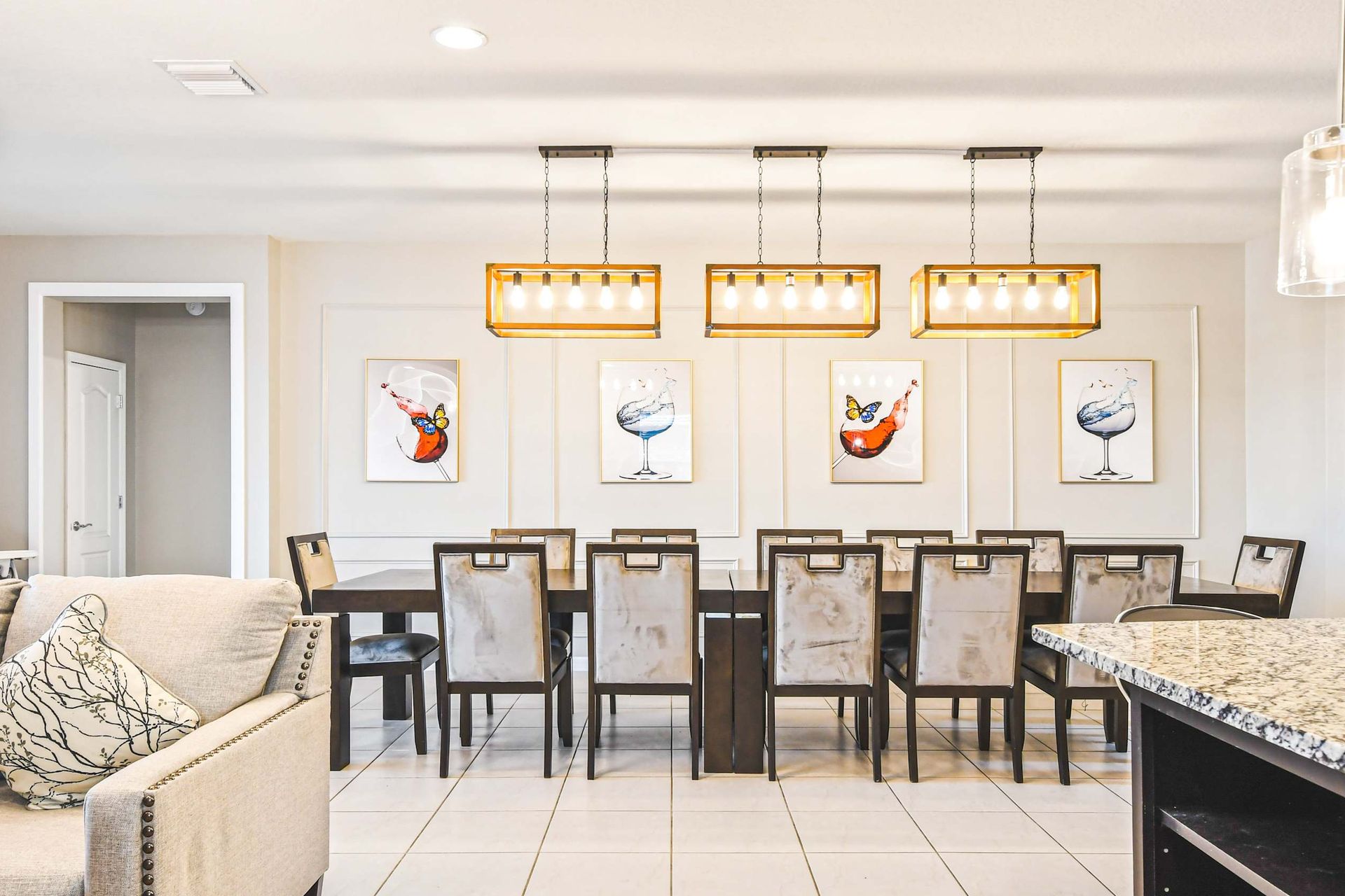 Elegant dining space with chic lighting, modern art, and seating for the whole group!