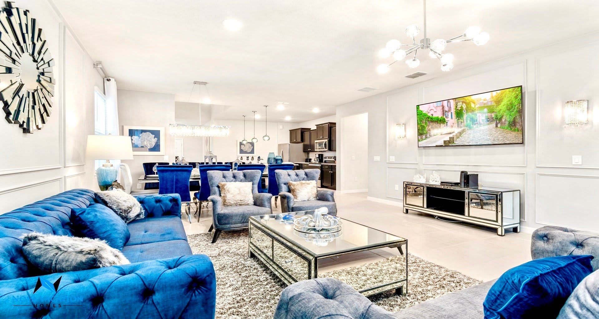 Luxurious living room includes a large TV.