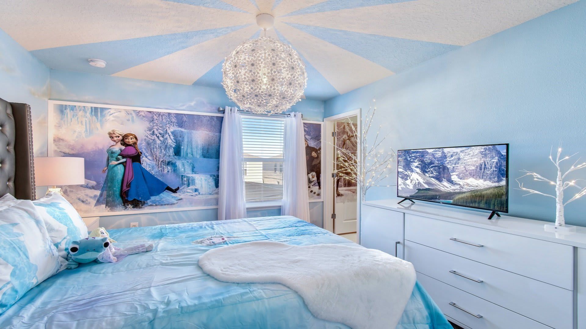 Frozen themed room includes flat screen TV.