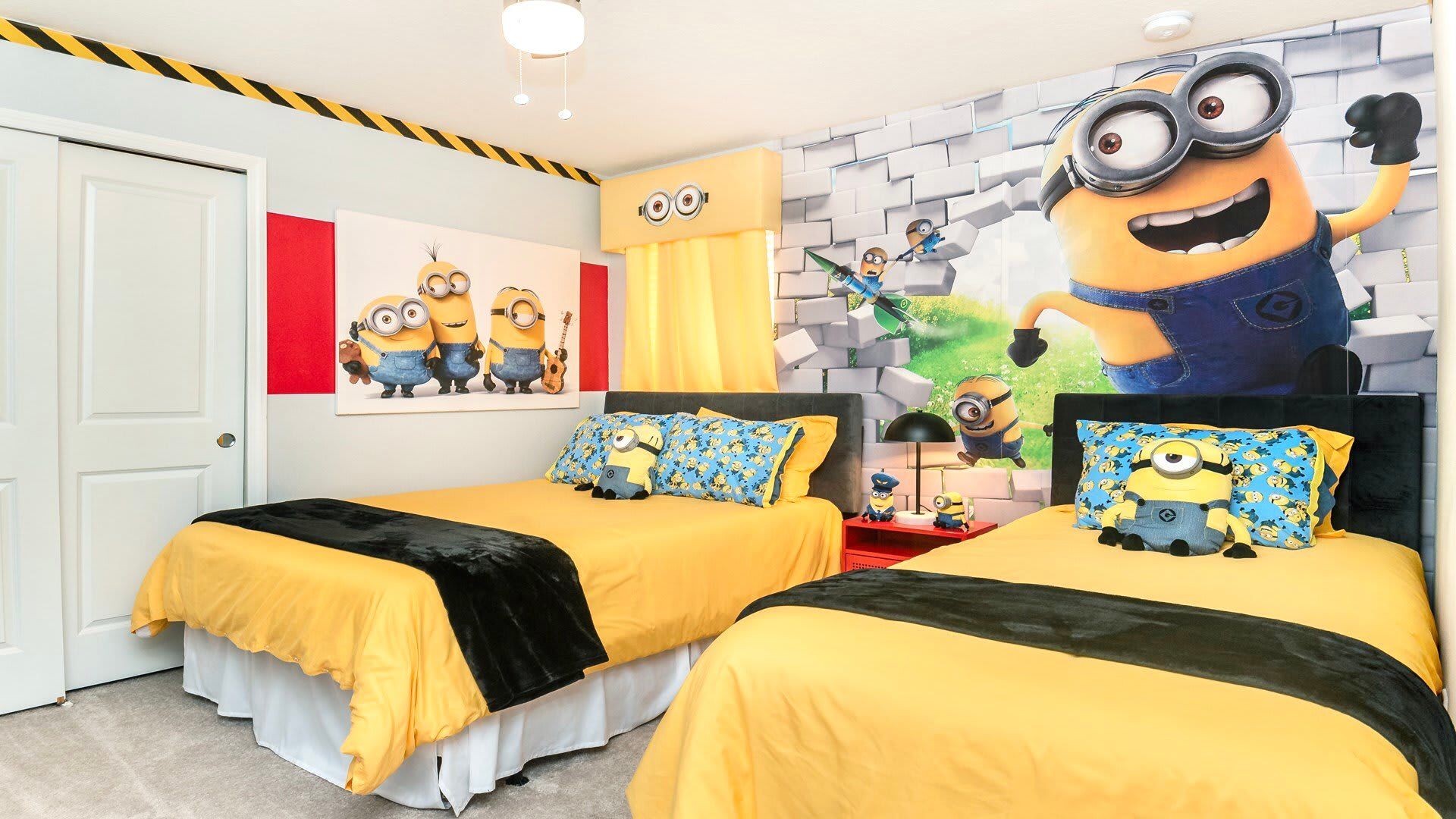 Vibrant Minions-themed bedroom with cheerful yellow bedding and playful decor.