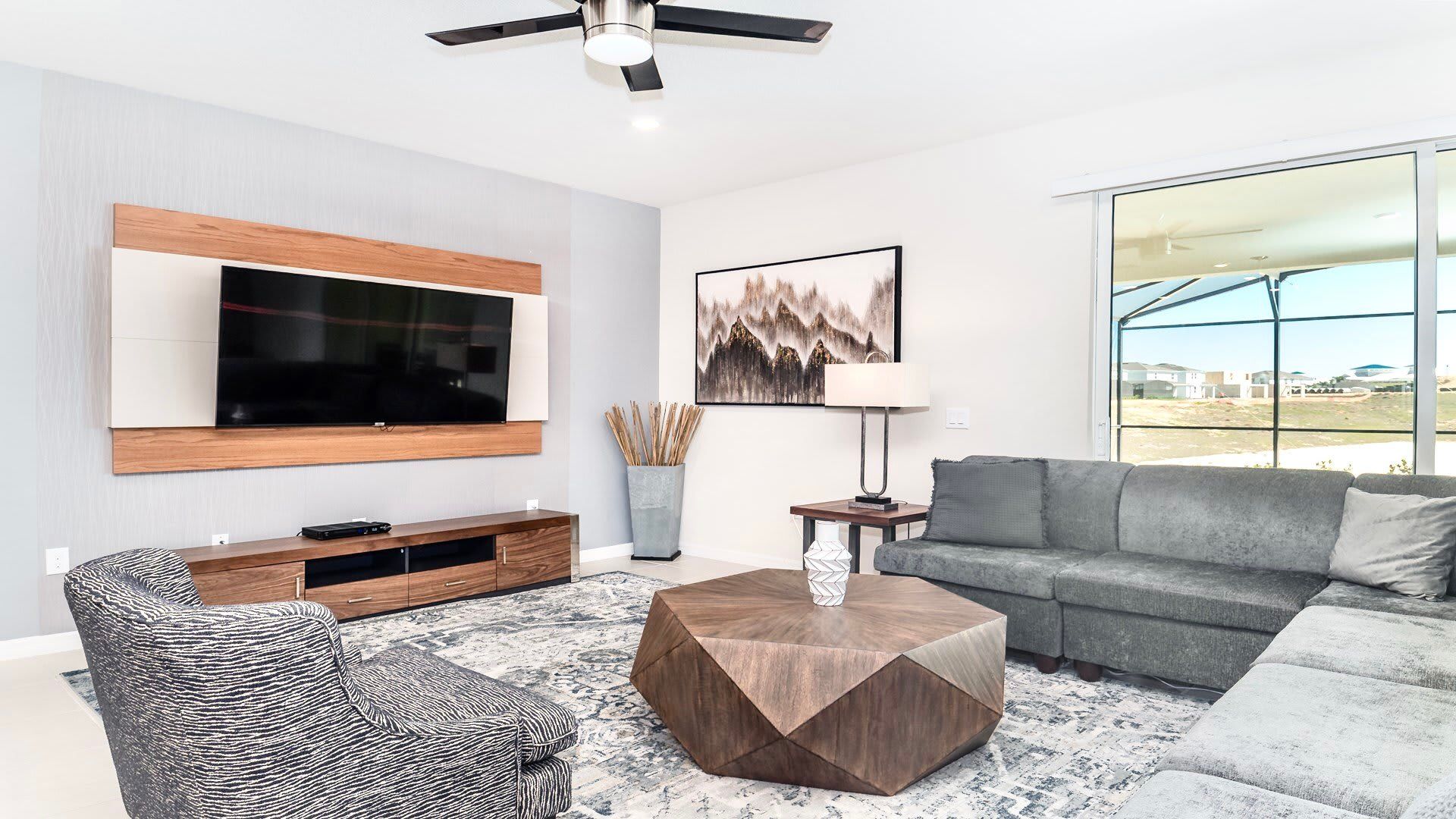 Living room with large TV and comfortable couches. Perfect for the whole family.