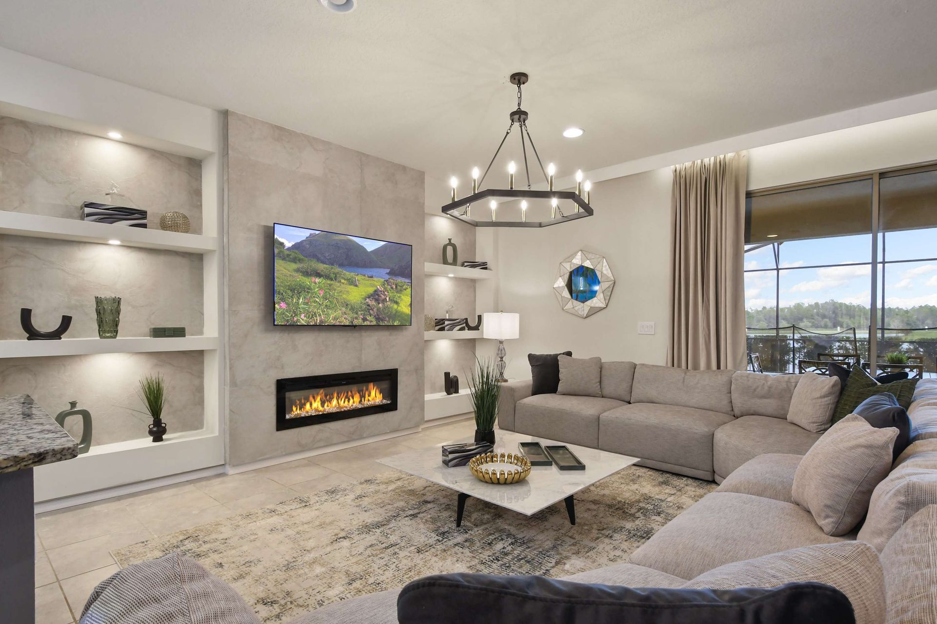 Stylish & cozy living space with lake views, fireplace, and modern elegance!