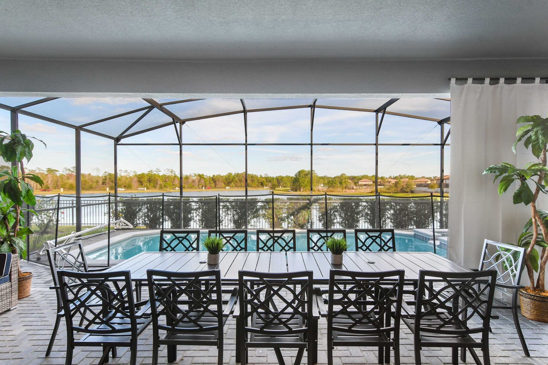 Relax by the pool with stunning lake views in this serene outdoor oasis!