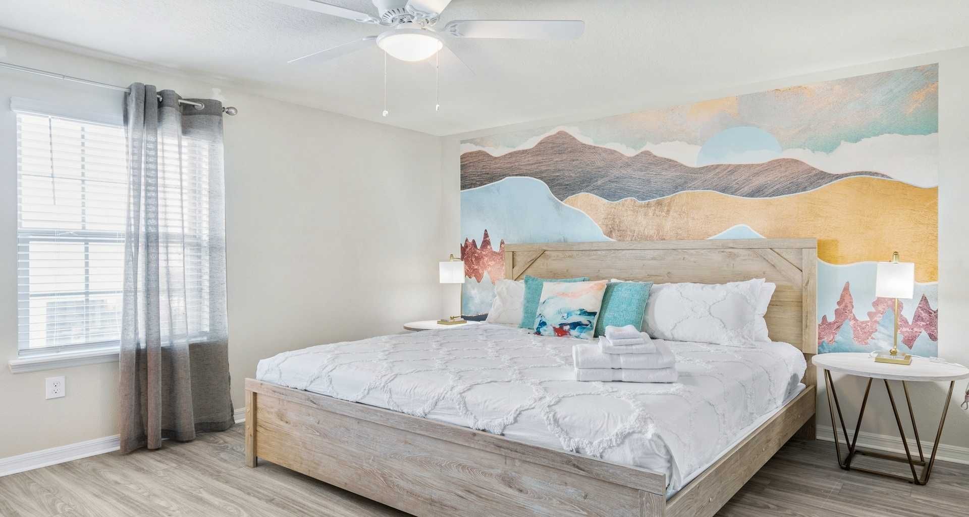 Spacious bedroom includes a king size bed.