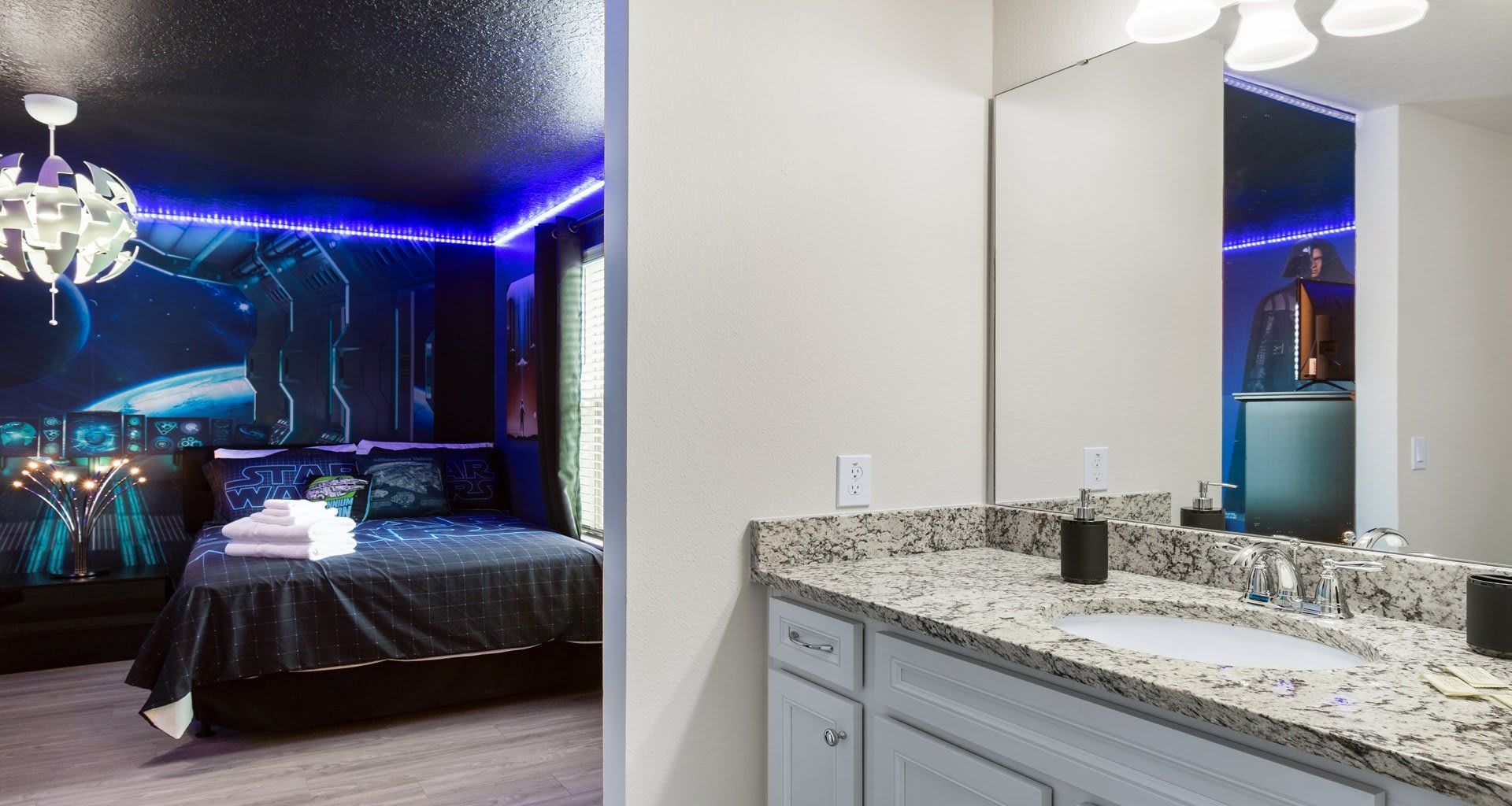 Galactic-themed bedroom with LED lighting, space decor, and a sleek modern bathroom!