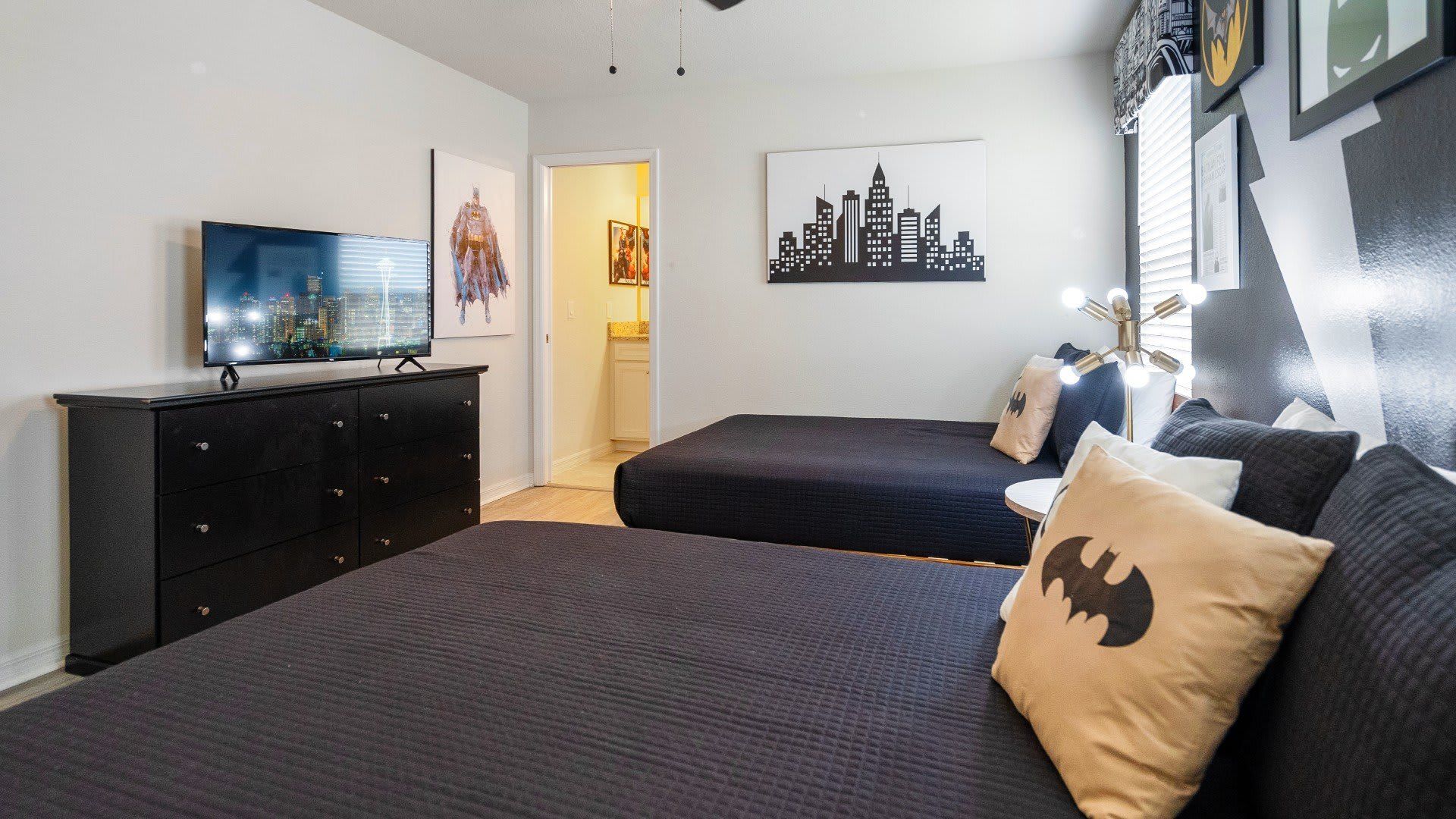 Hero-themed bedroom with twin beds, cityscape decor, and stylish comic-inspired design!