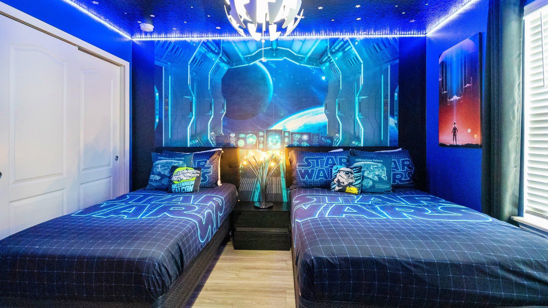 Stay in this epic Star Wars-themed room with twin beds, galaxy vibes, and LED lights!