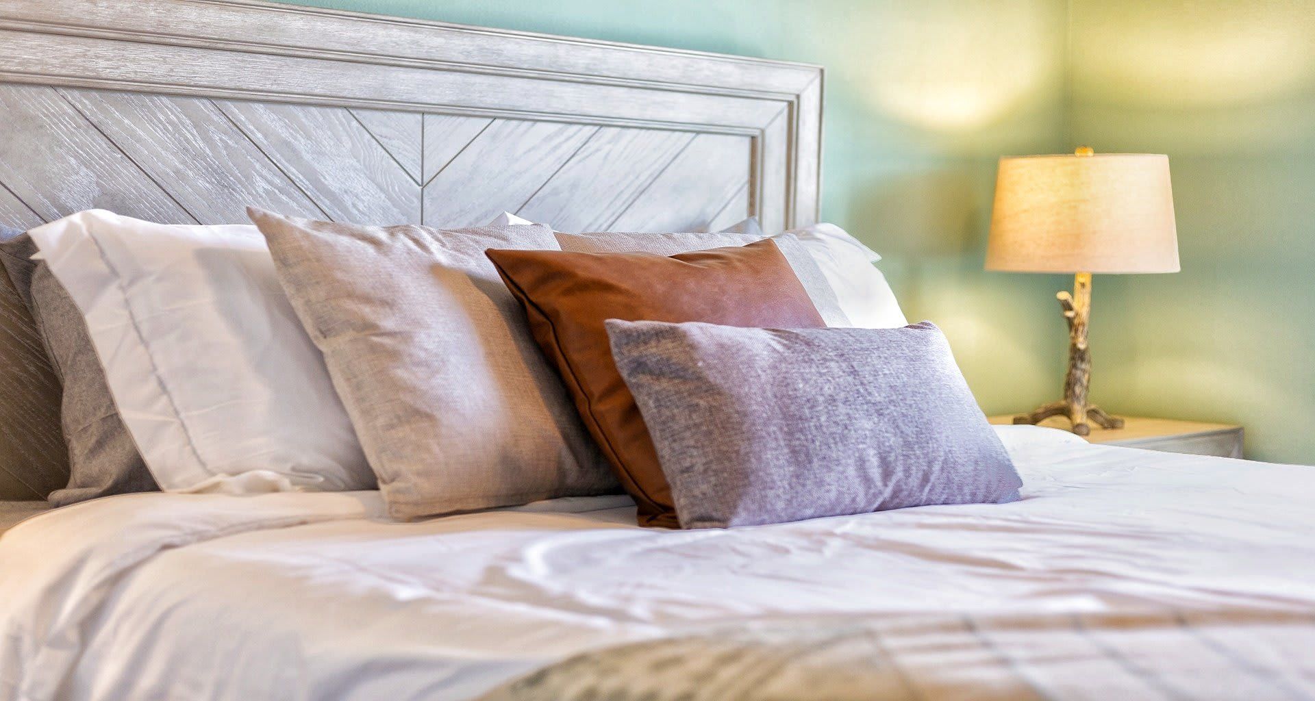 The spacious bedroom with a comfortable queen bed