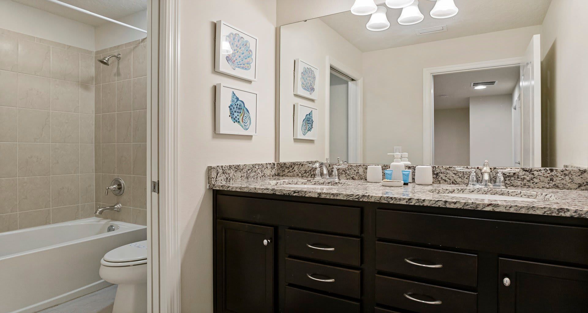 Bathroom: Functional and pristine, providing a clean and well-appointed space