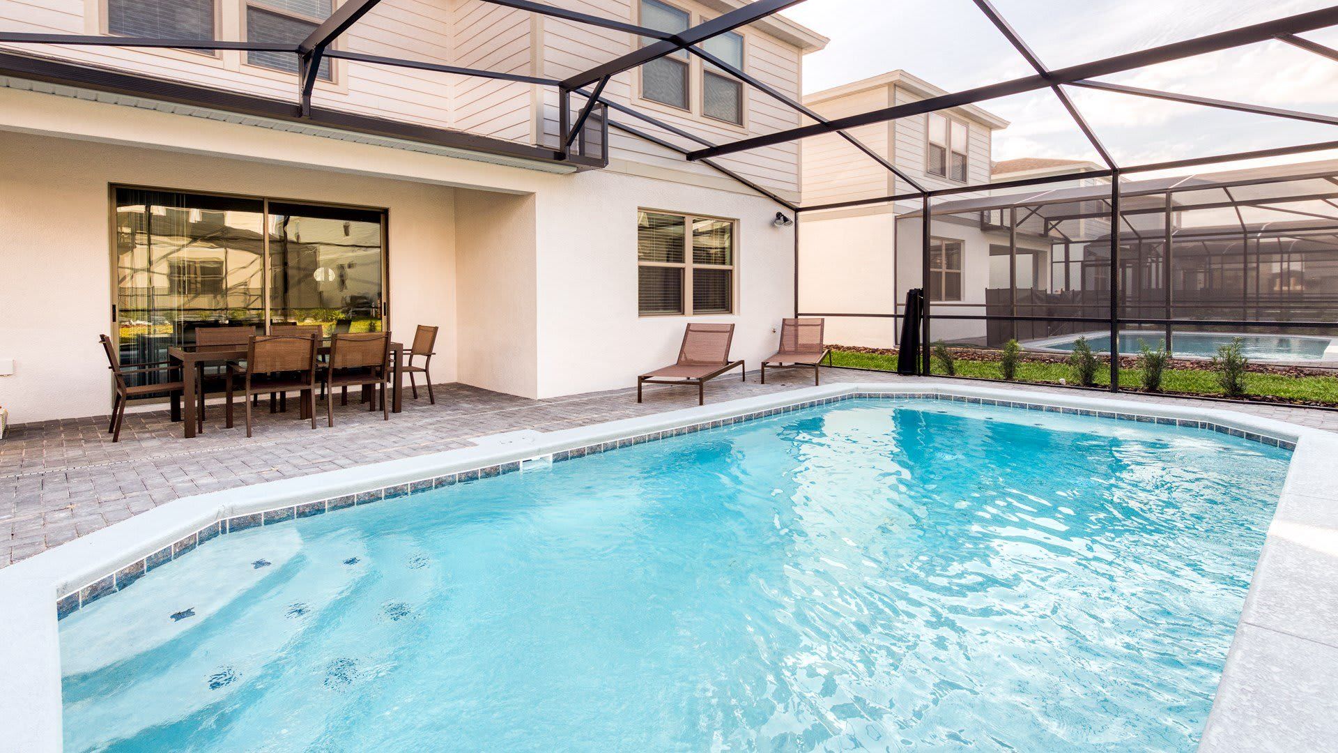 Private Oasis: Enjoy exclusive access to the screened-in spa and pool