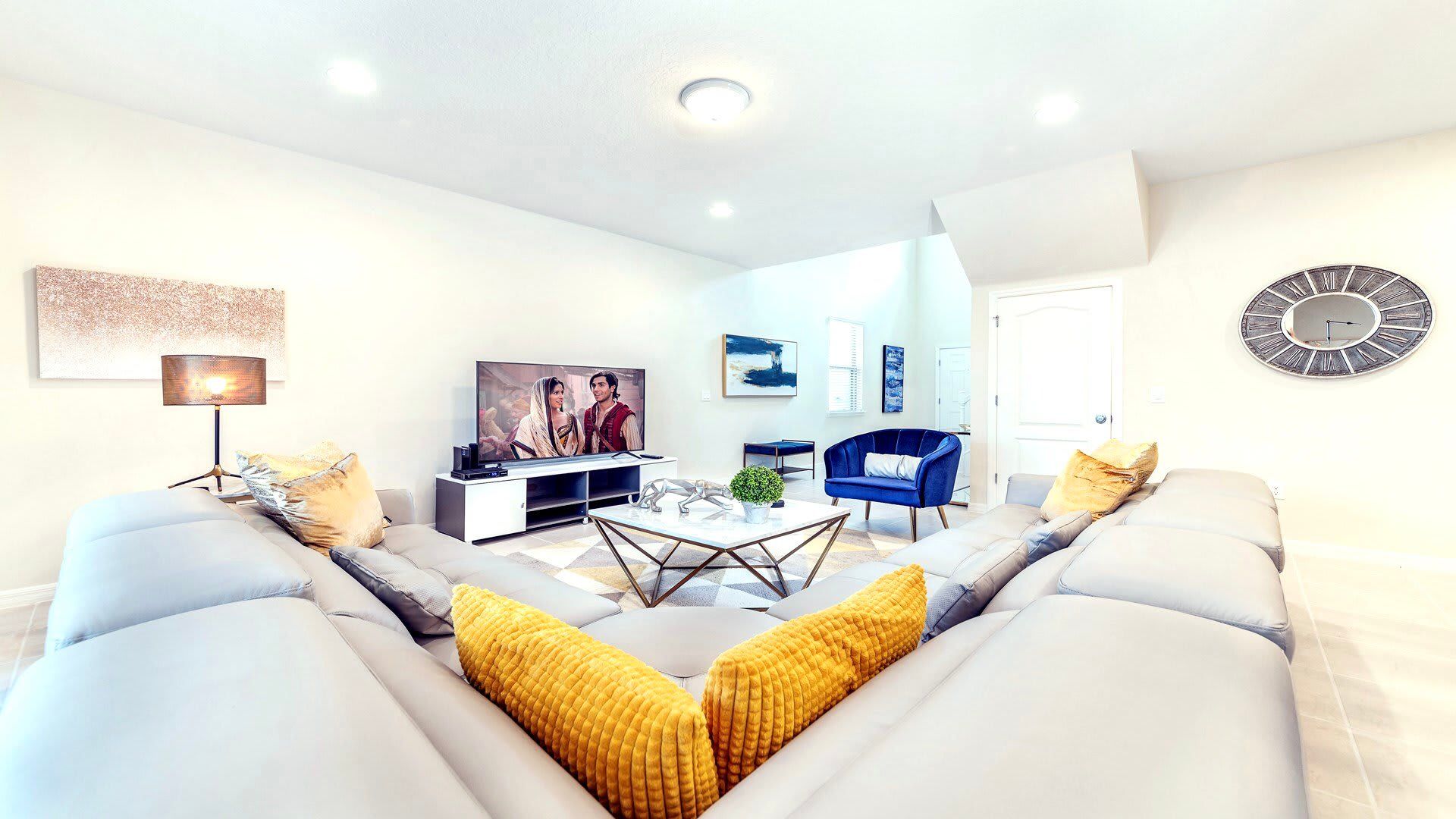 Living Room: Spacious and inviting, the area features a cozy sofa