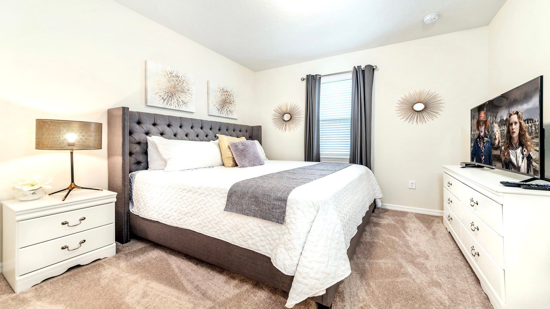 King Bedroom: Cozy retreat featuring a plush king-sized bed and a TV
