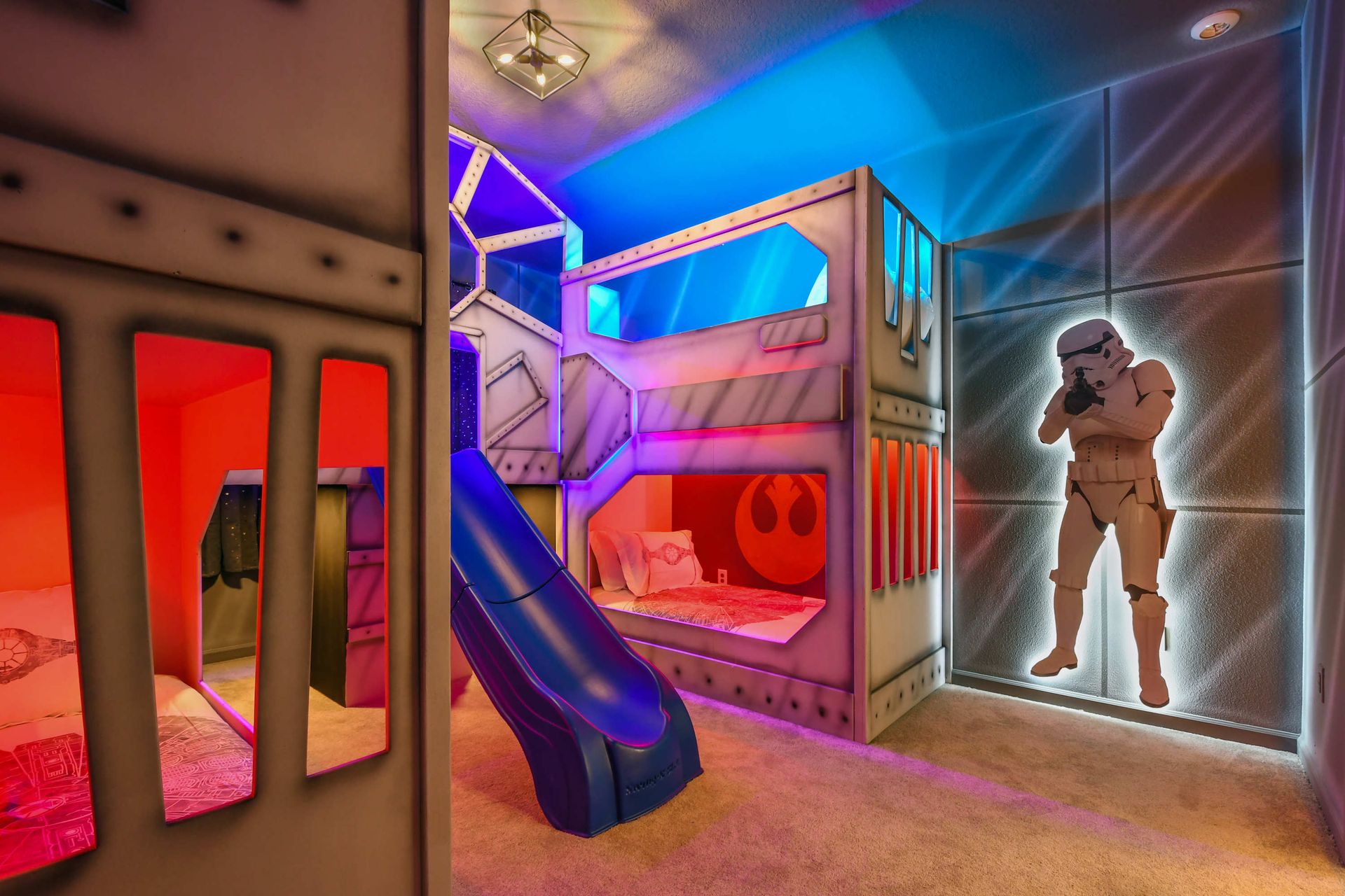 Experience an intergalactic adventure in this Star Wars-themed room featuring bunk beds with a slide and life-sized Stormtroopers.