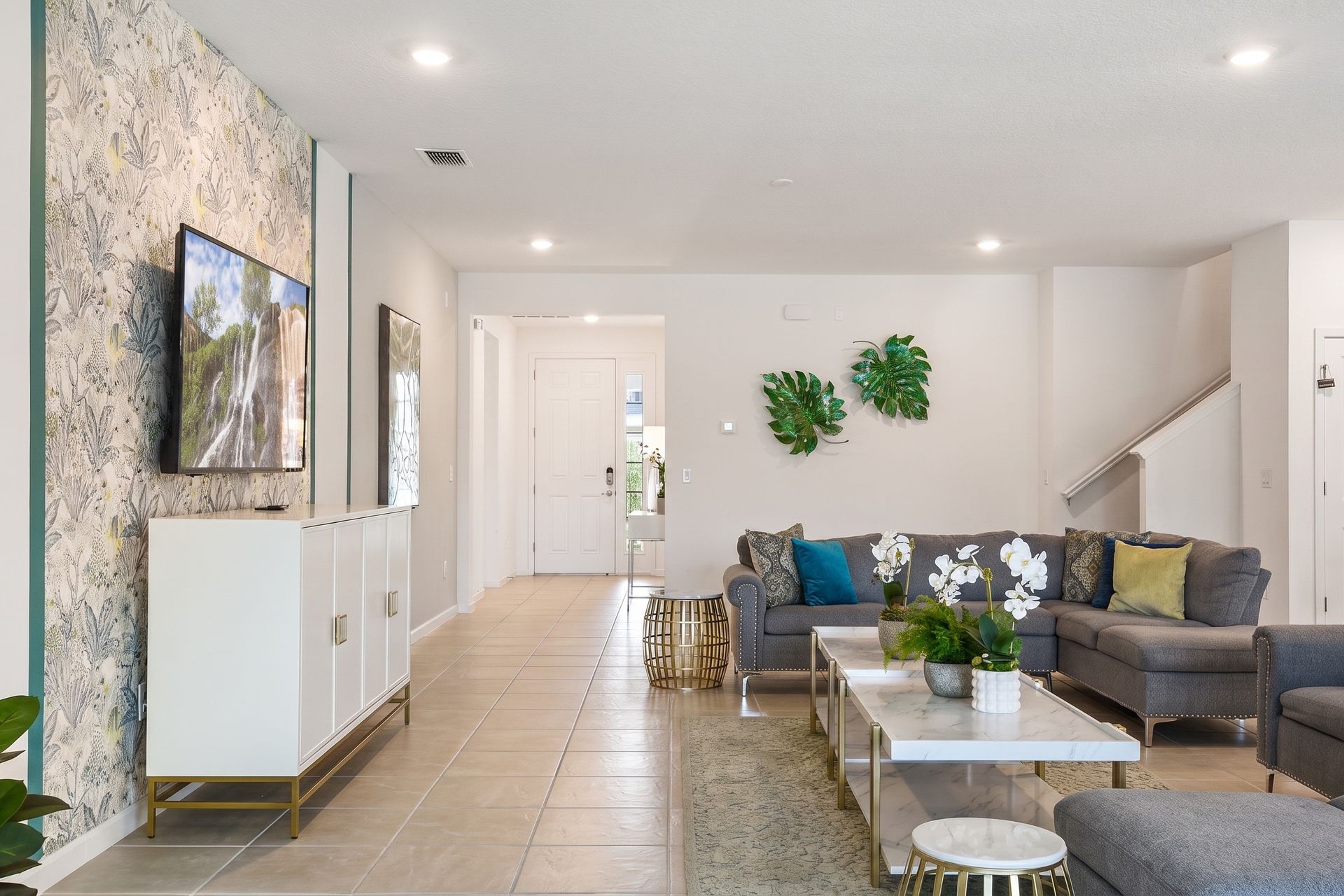 Spacious and stylish living area with elegant décor, plush seating, and modern charm!