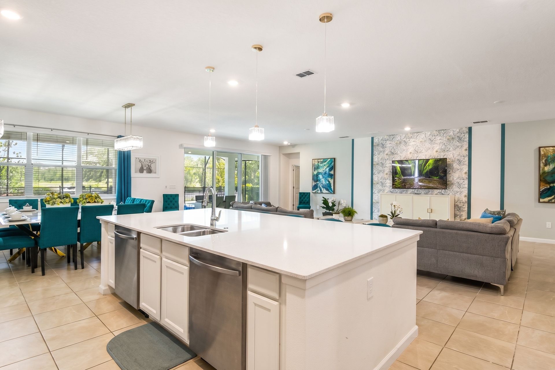 Modern open-concept kitchen with a spacious island, elegant lighting, and cozy vibes!