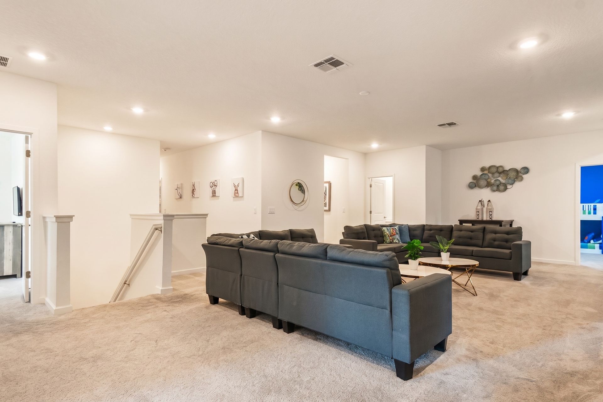 Spacious upstairs loft with plush seating, modern décor, and a perfect entertainment spot!