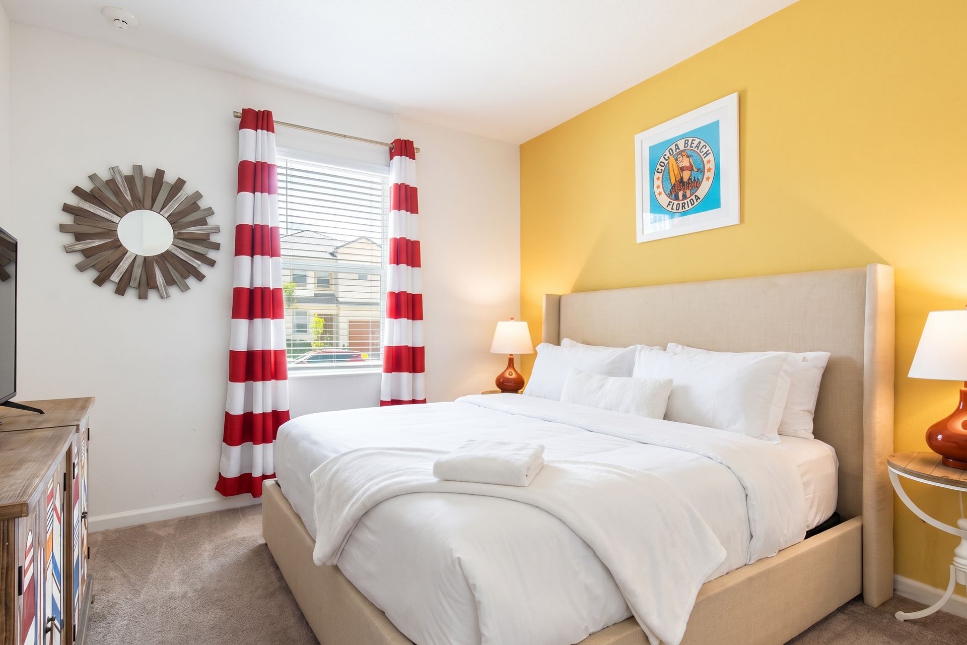 Bright and cozy bedroom with a beachy vibe, comfy bed, and stylish décor!