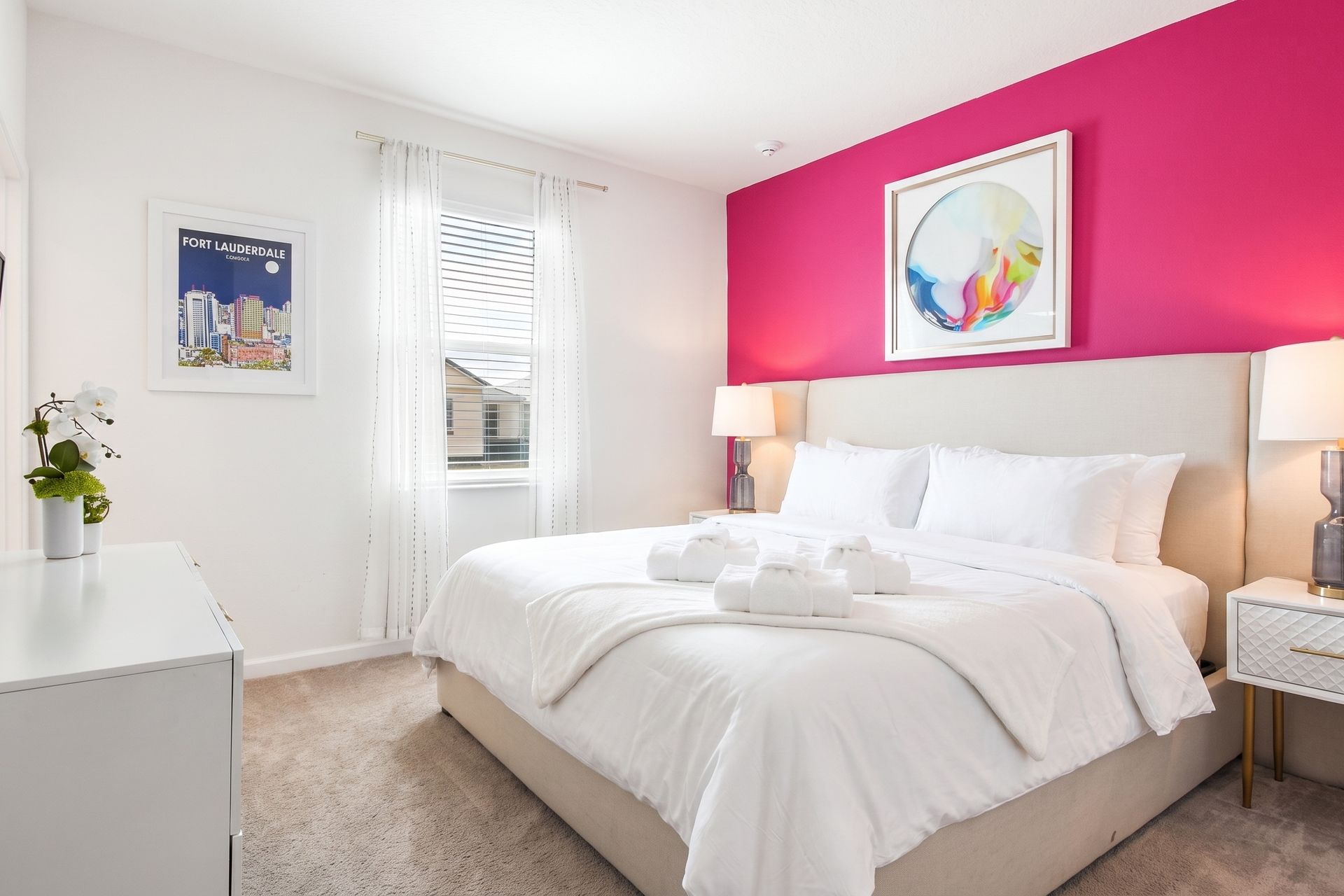 Vibrant and modern bedroom with a bold accent wall, cozy bed, and stylish décor!
