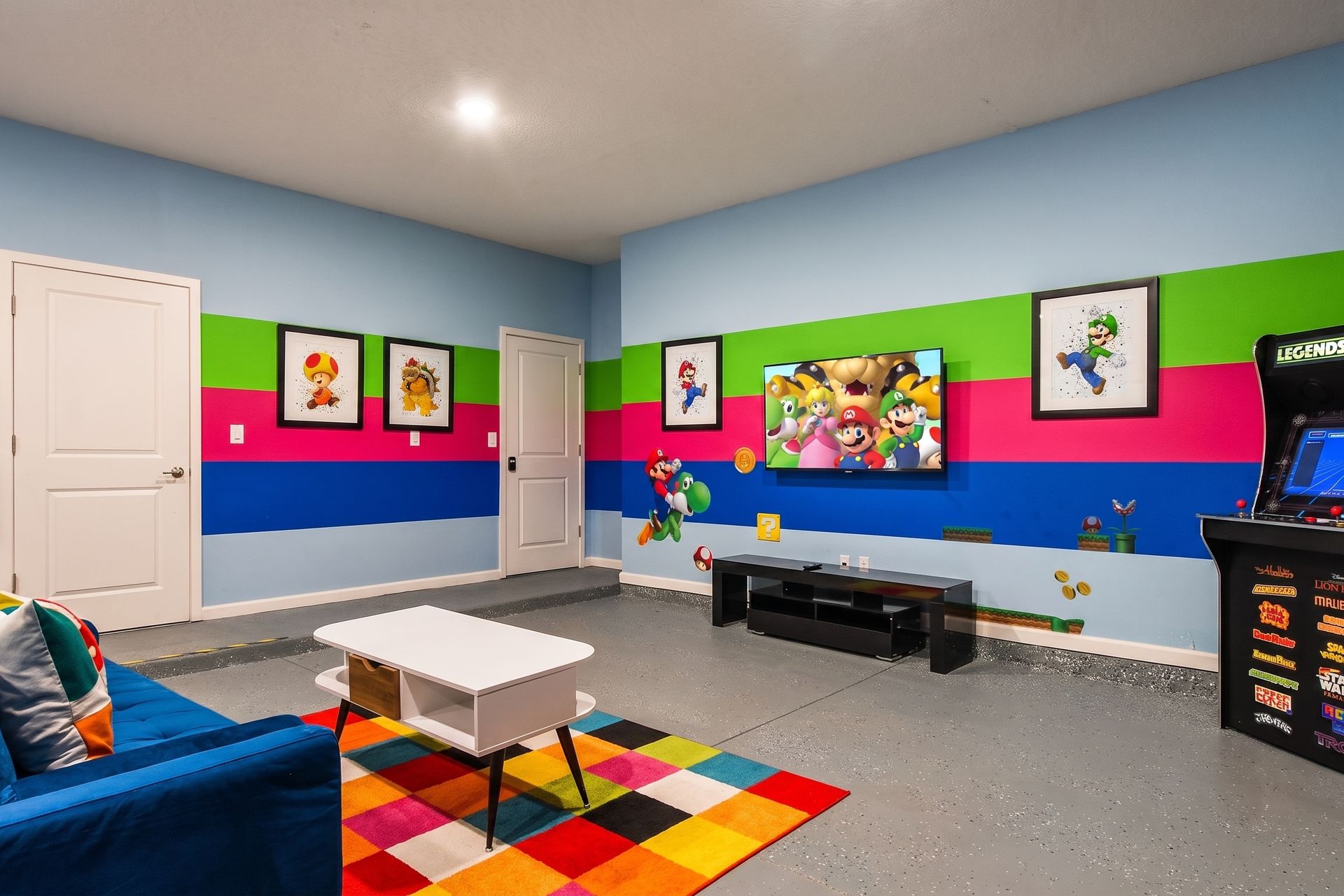 Exciting game room with arcade games, vibrant décor, and a fun Mario-themed vibe!