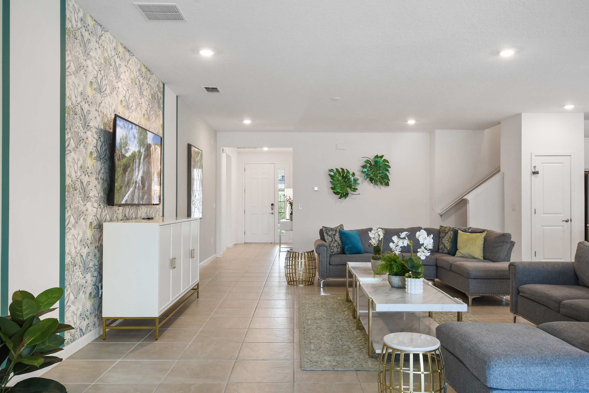 Spacious and stylish living area with elegant décor, plush seating, and modern charm!