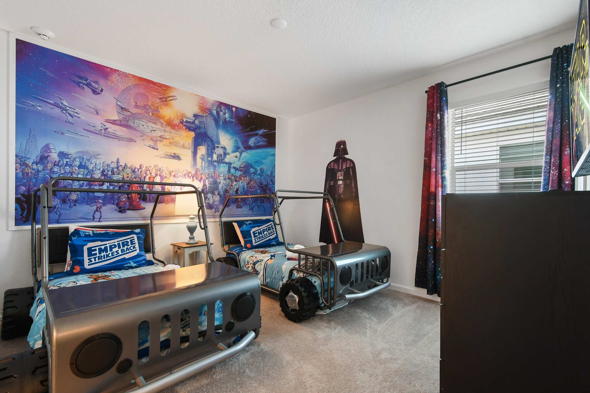 Epic Star Wars-themed bedroom with unique Jeep beds, galactic décor, and adventure!