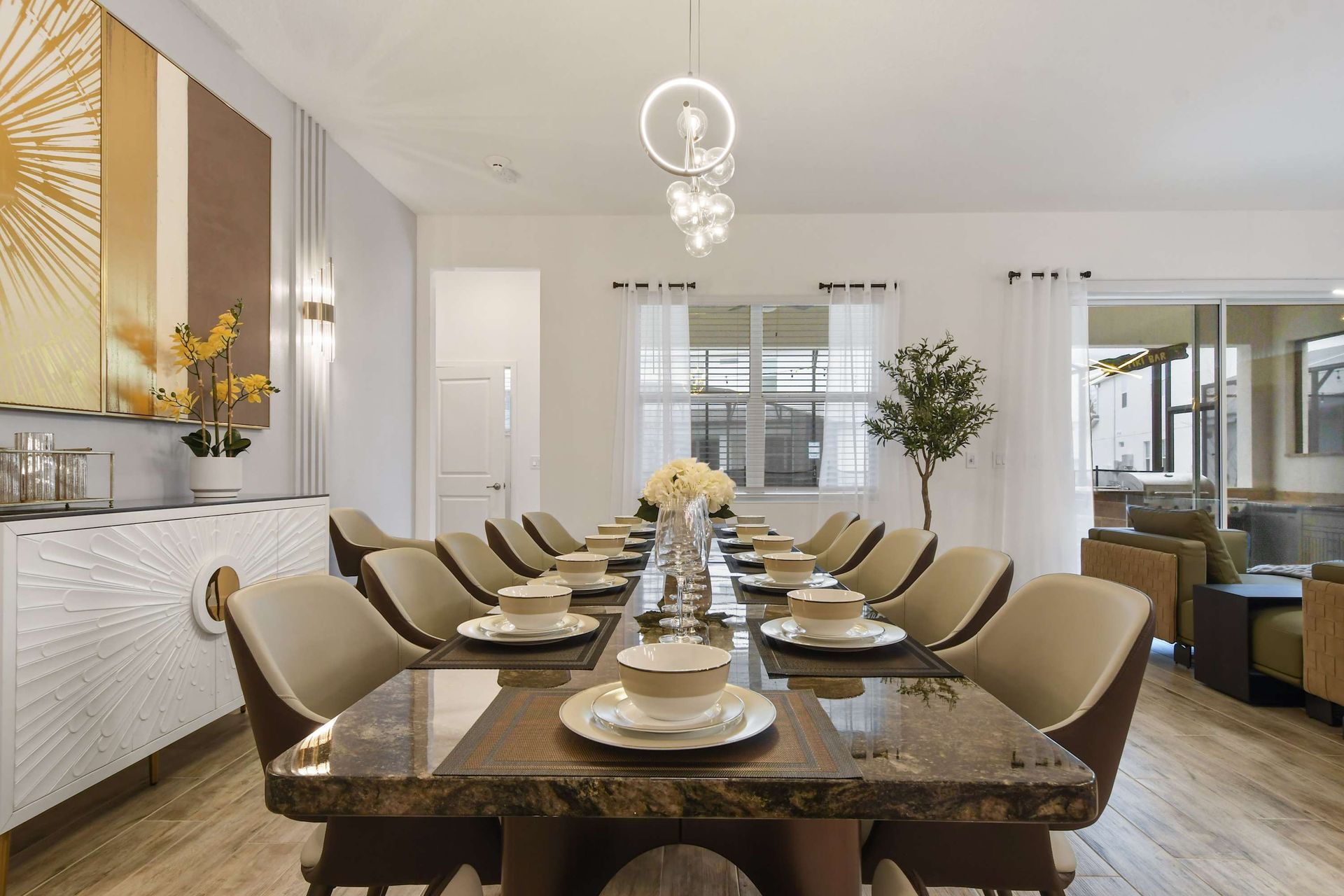 Stunning dining area with elegant seating, modern lighting, and a beautifully set table.
