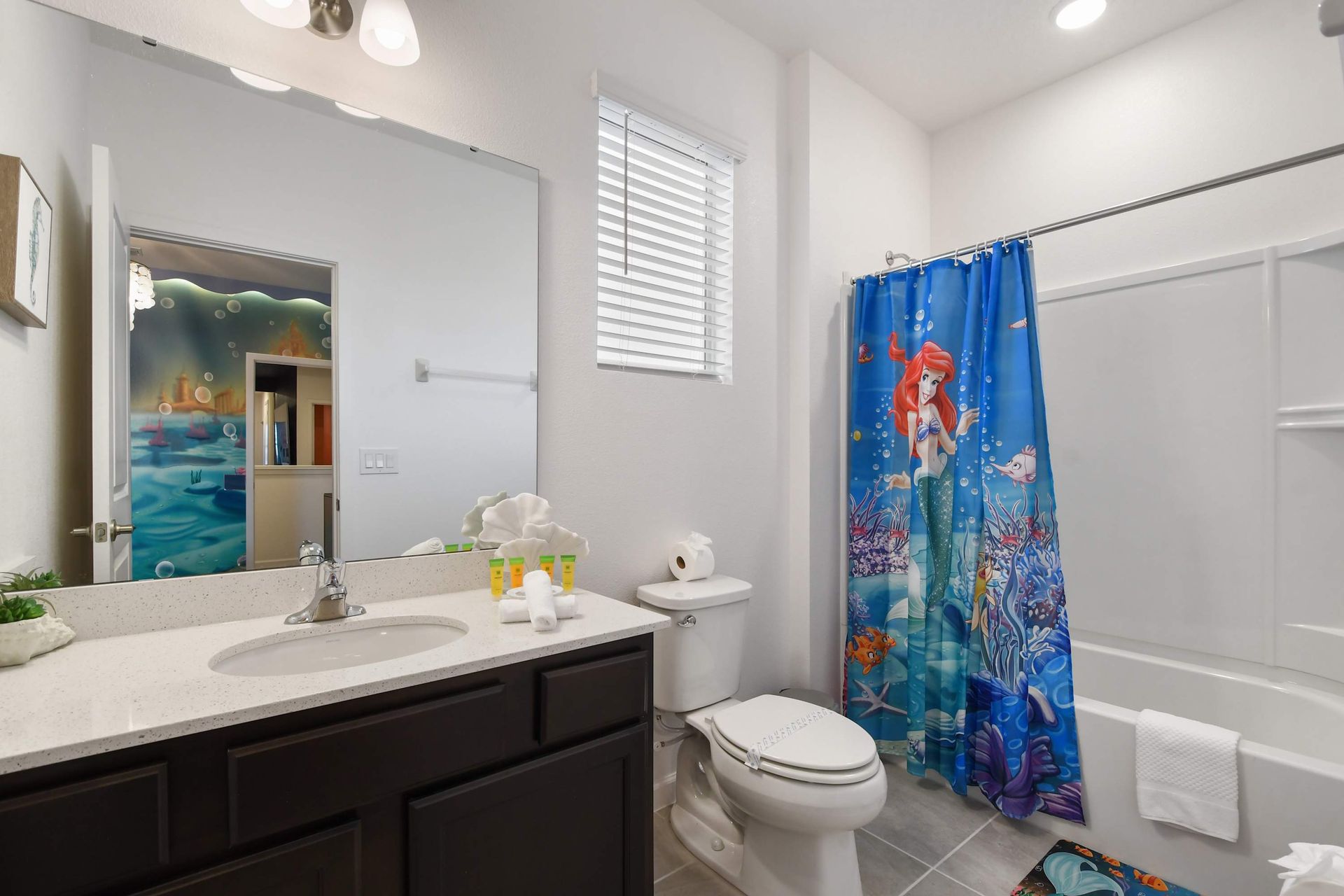 Spacious master bathroom with dual sinks, a glass-enclosed shower, and modern touches!