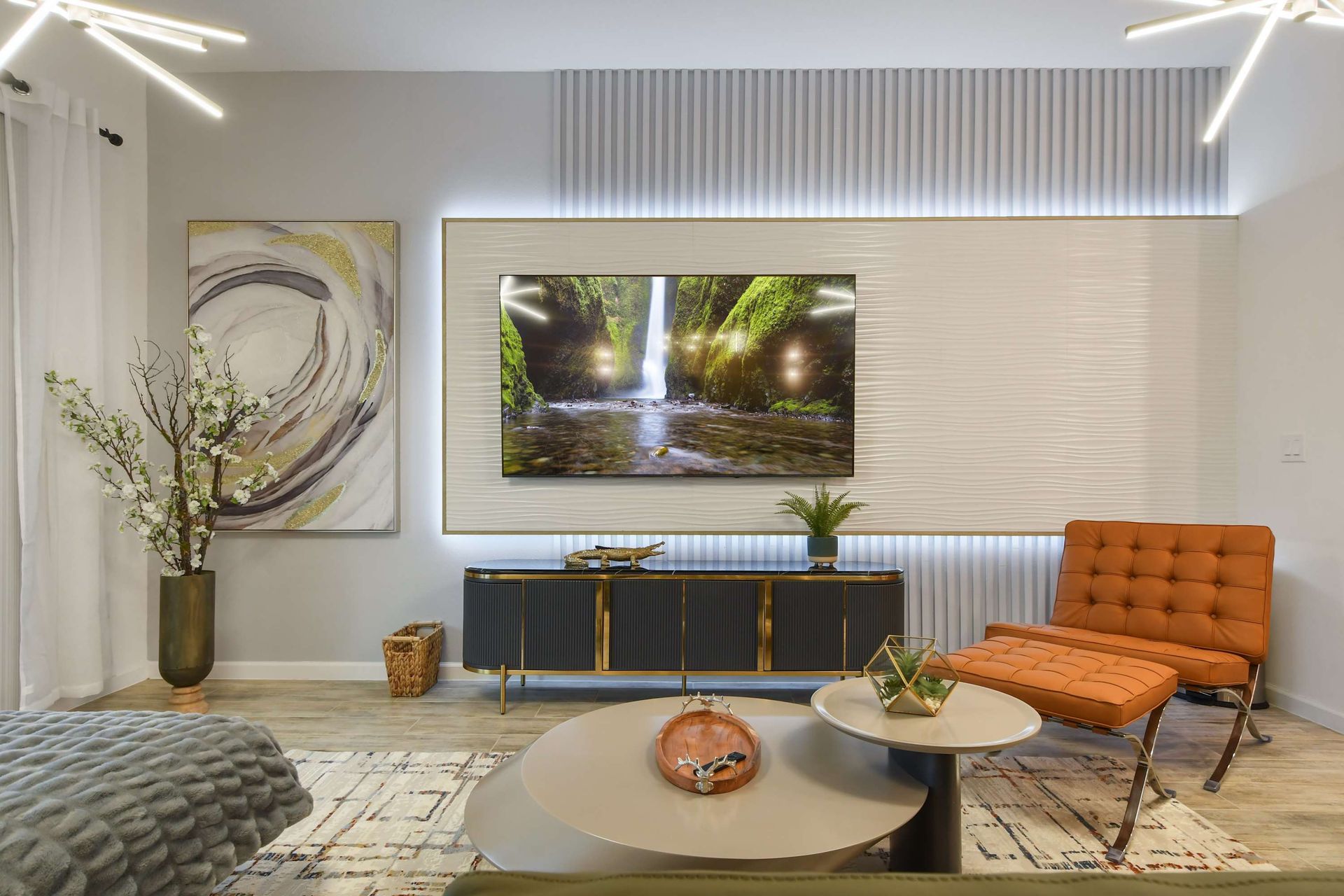 Sophisticated living area with modern decor, ambient lighting, and a sleek design.