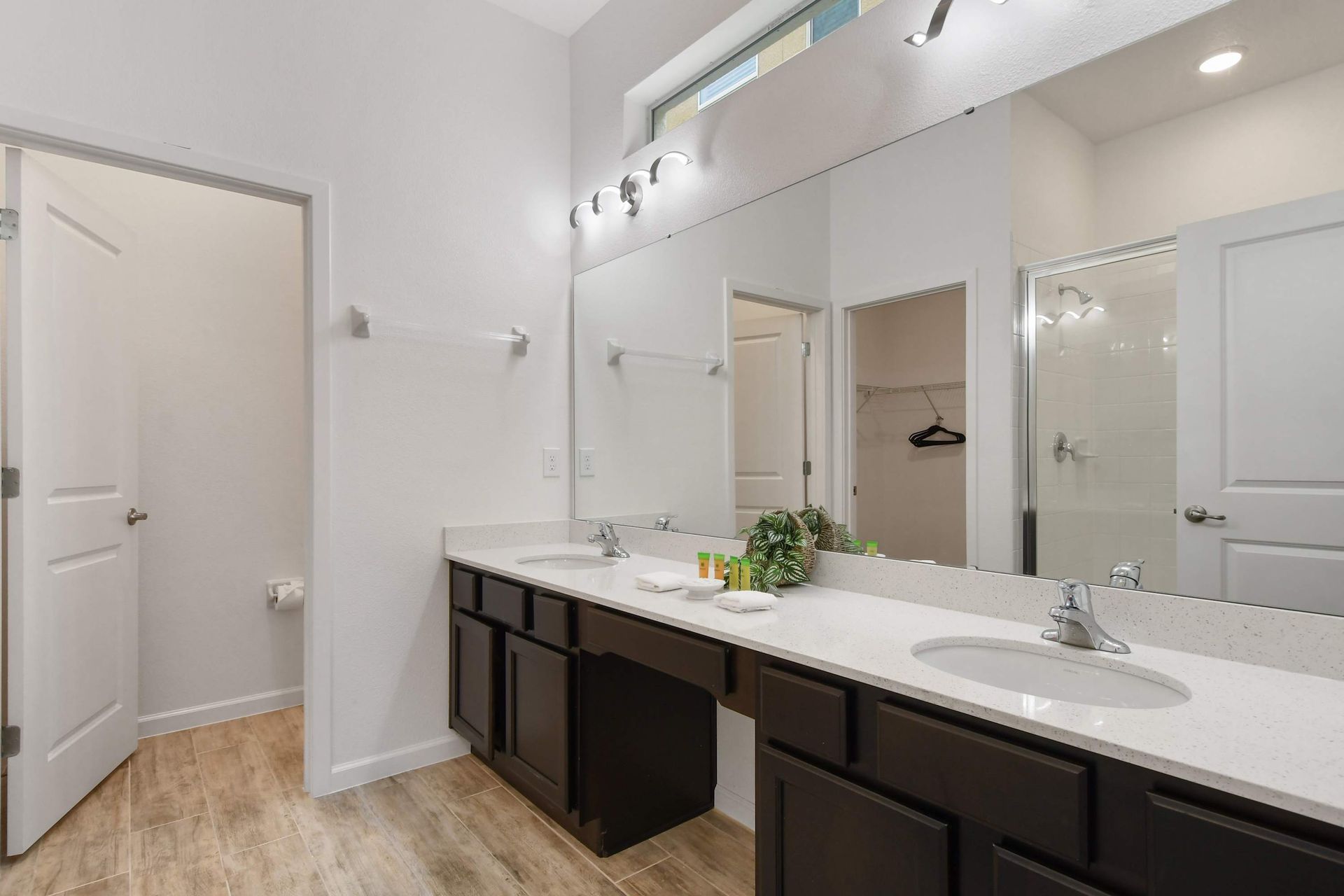 Bright double-sink bathroom with modern decor and a fun Star Wars touch!