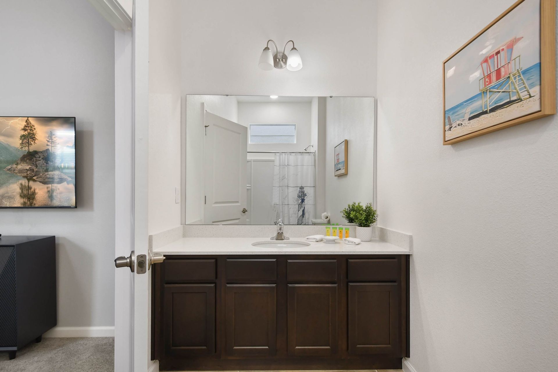 Bright double-sink bathroom with modern decor and a fun Star Wars touch!
