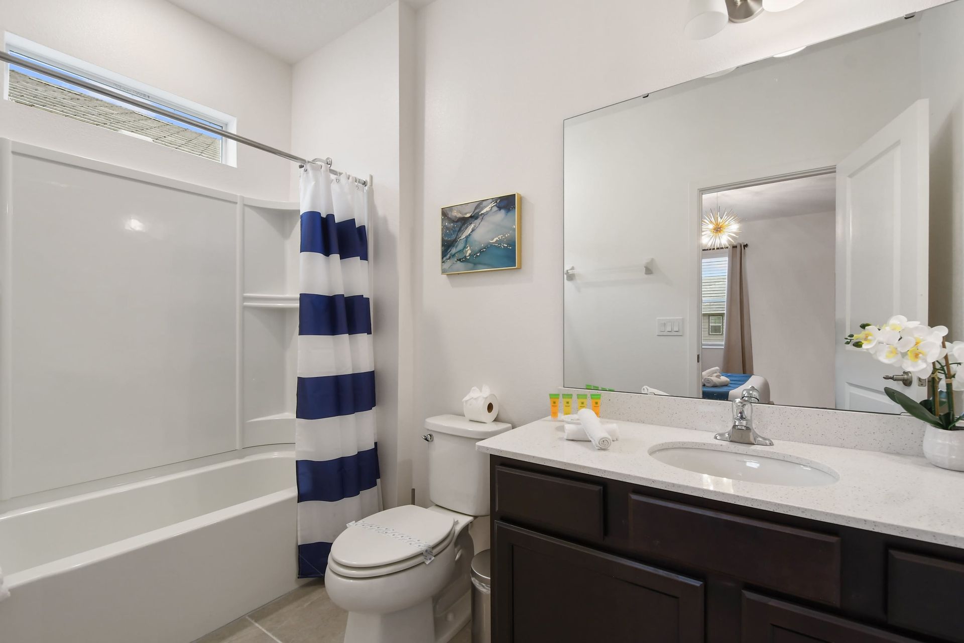 Spacious master bathroom with dual sinks, a glass-enclosed shower, and modern touches!
