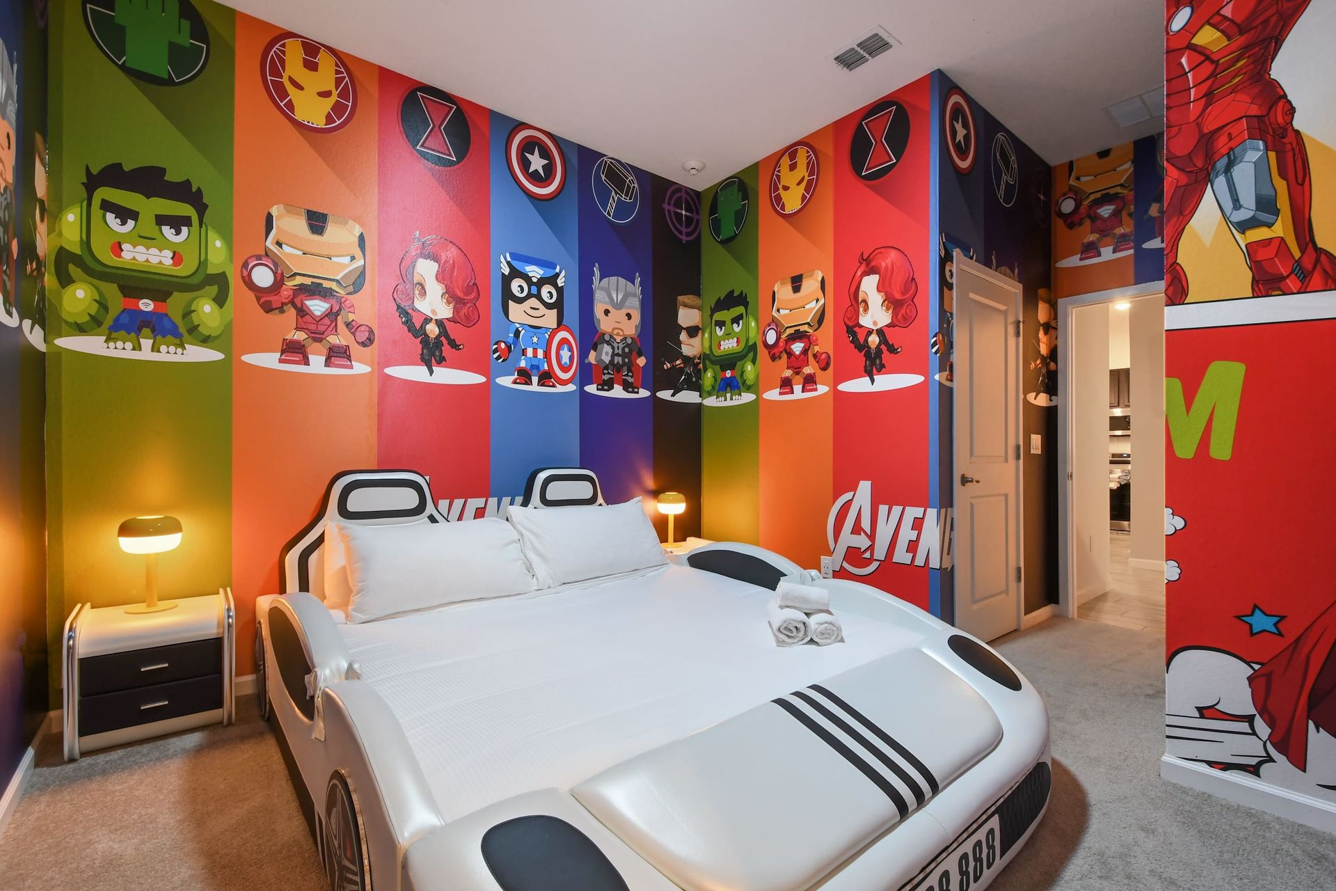 Epic superhero-themed bedroom with a cool car bed—perfect for Marvel fans! 
