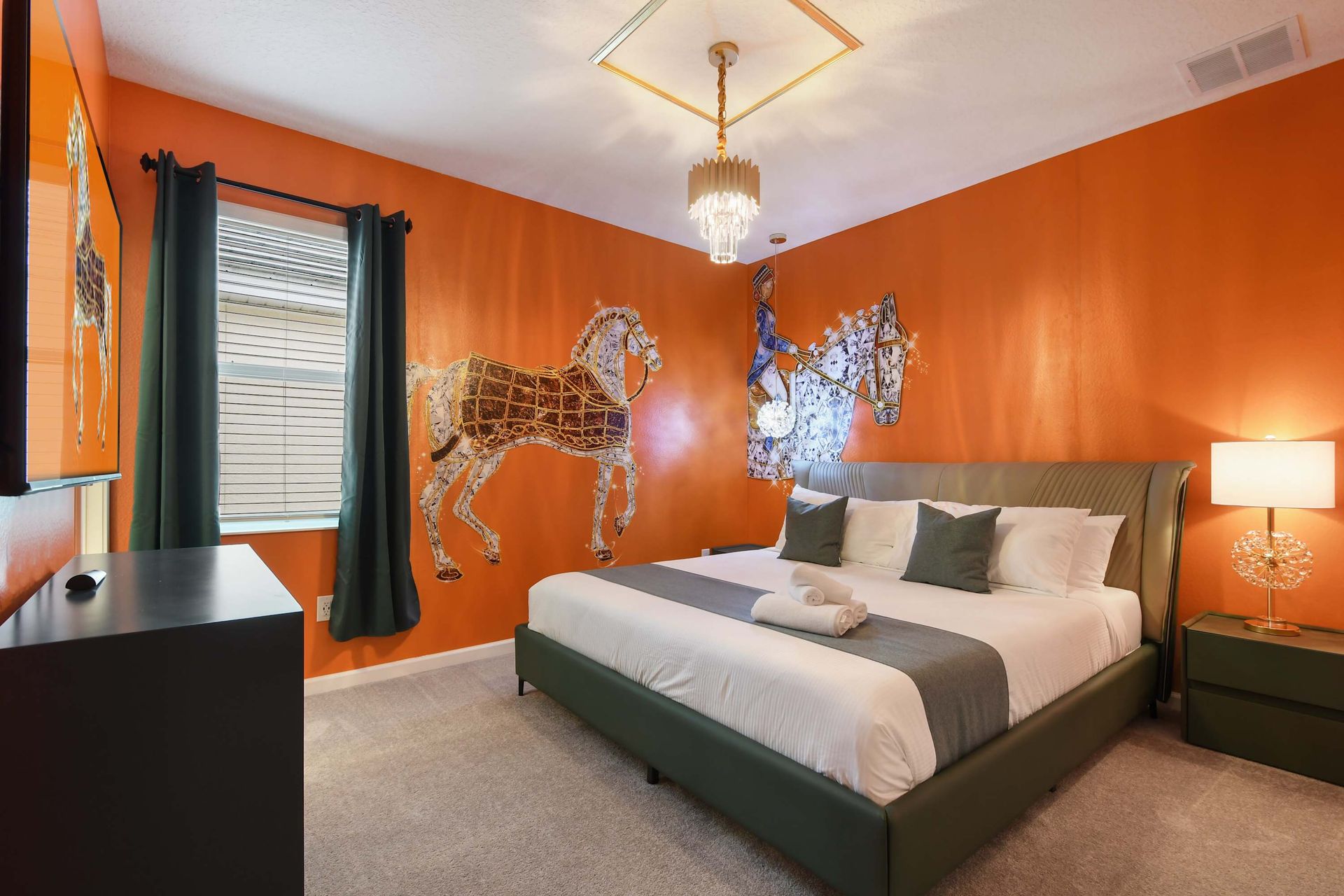 Elegant equestrian-themed bedroom with bold decor, warm lighting, and a plush king bed.