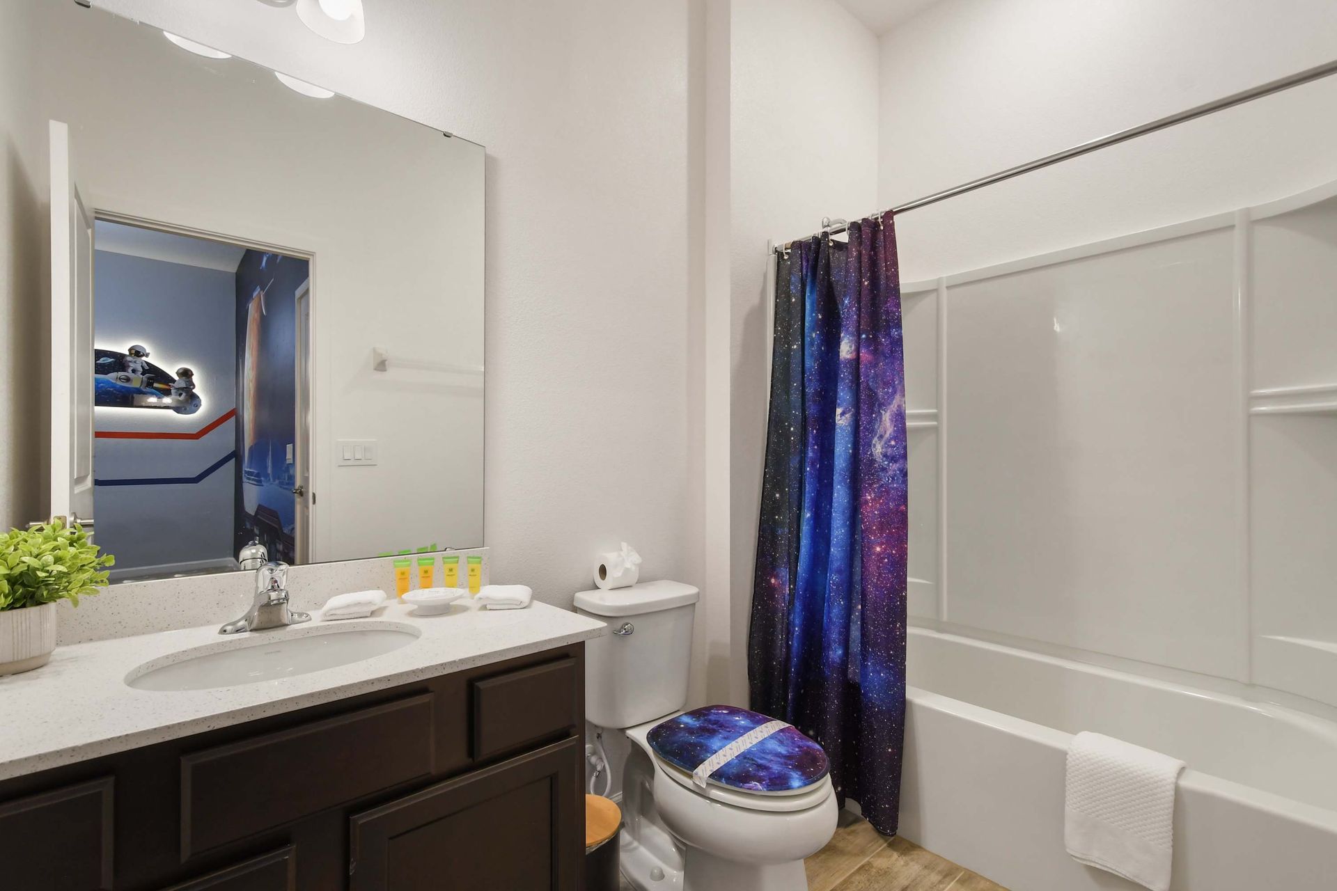 Spacious master bathroom with dual sinks, a glass-enclosed shower, and modern touches!