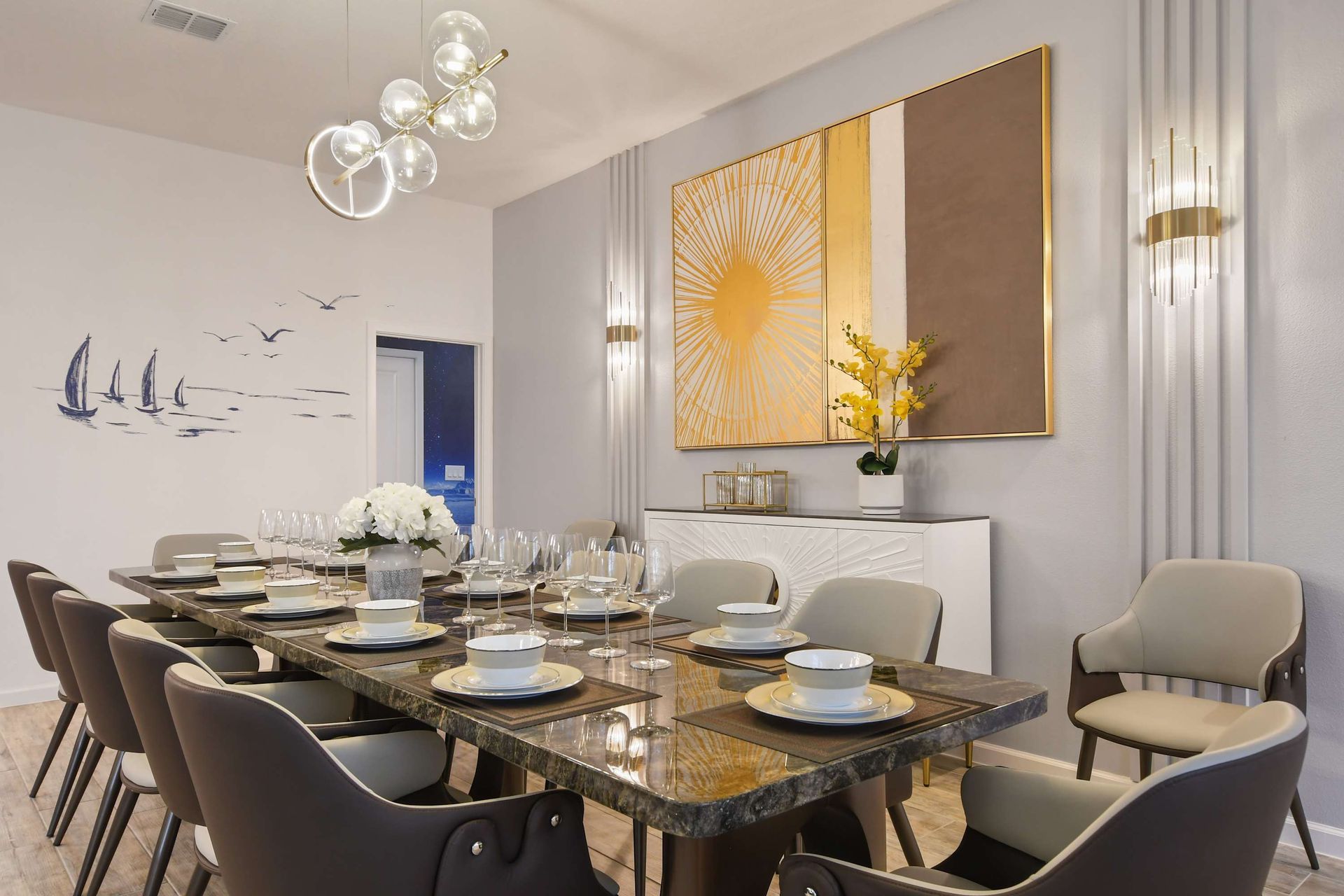 Elegant dining room with modern decor, luxurious seating, and a beautifully set table.