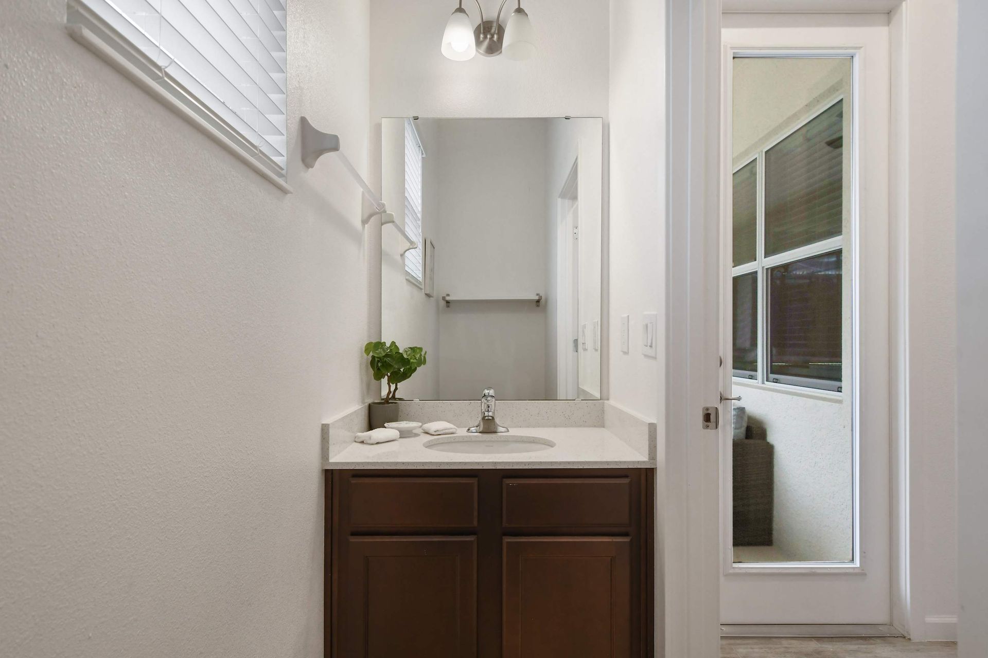 Bright double-sink bathroom with modern decor and a fun Star Wars touch!