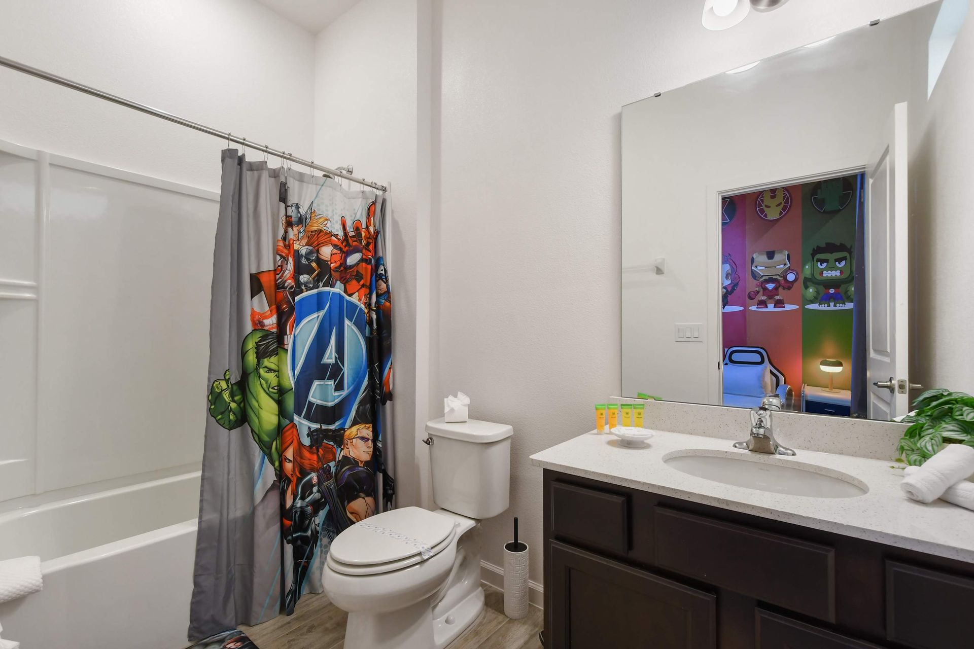 Spacious master bathroom with dual sinks, a glass-enclosed shower, and modern touches!