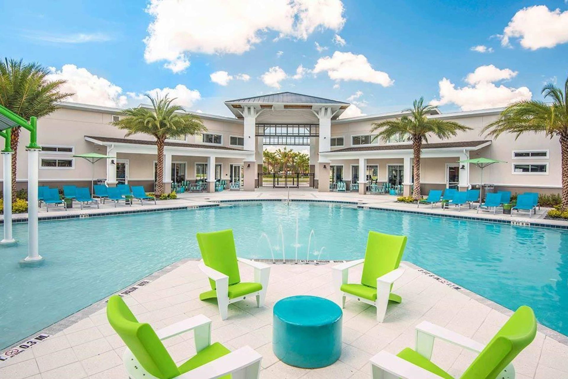 Resort-style escape with a stunning pool, splash zone, and luxury lounge seating