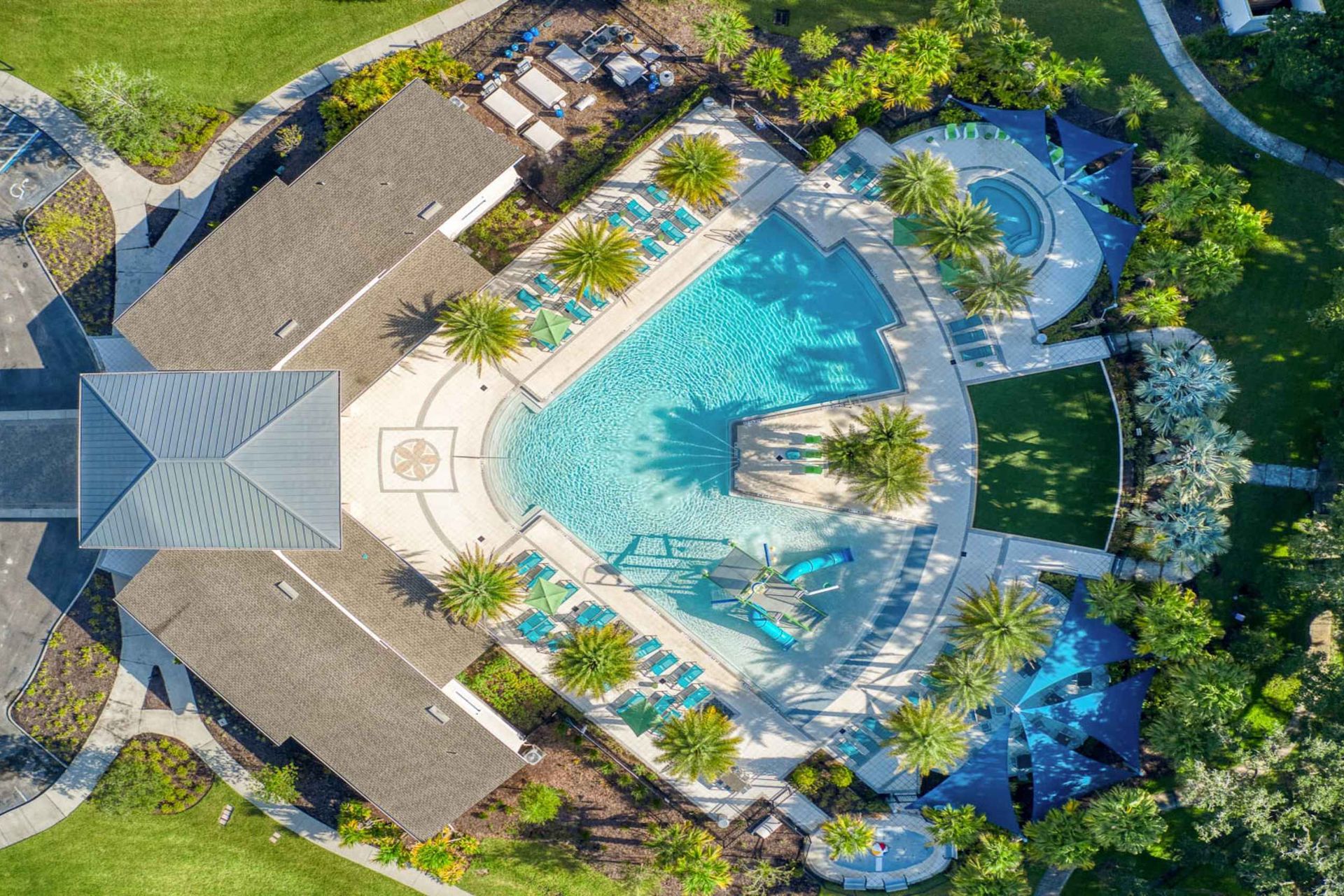 Luxury oasis with a resort-style pool, palm trees, and upscale outdoor lounges