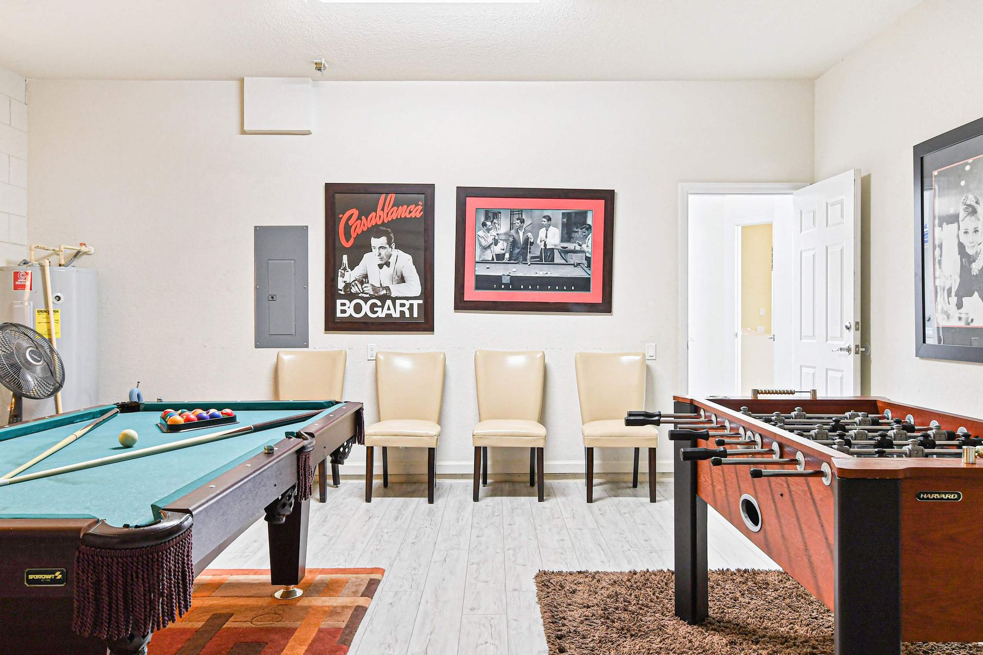 Fun-filled game room with pool, foosball, and classic decor—perfect for all ages!