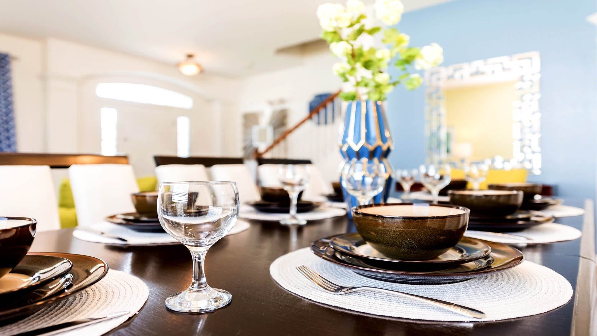 Stylish dining area with elegant table settings, modern decor, and warm ambiance.