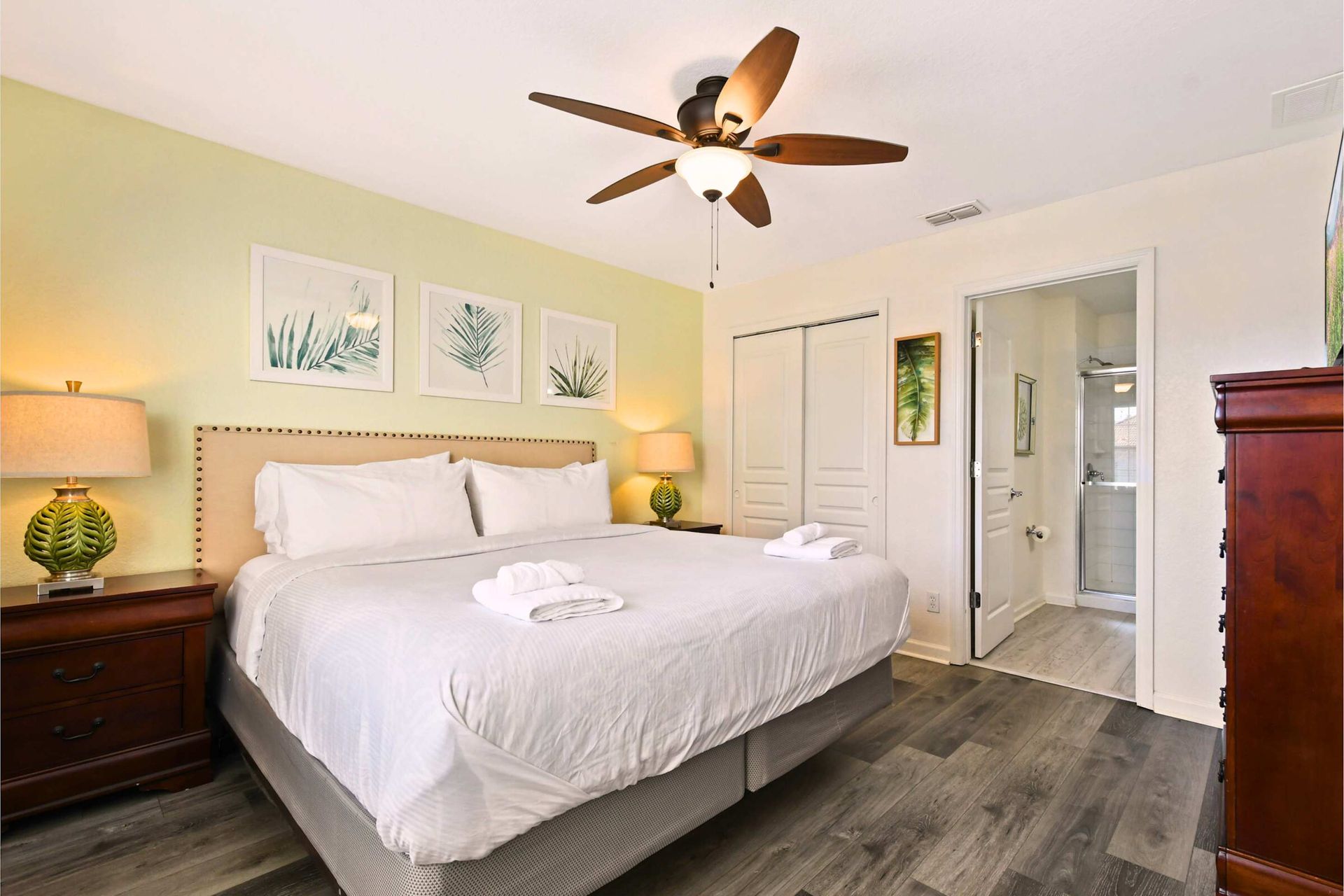 Serene bedroom with a plush king bed, elegant decor, and a private en-suite bath.