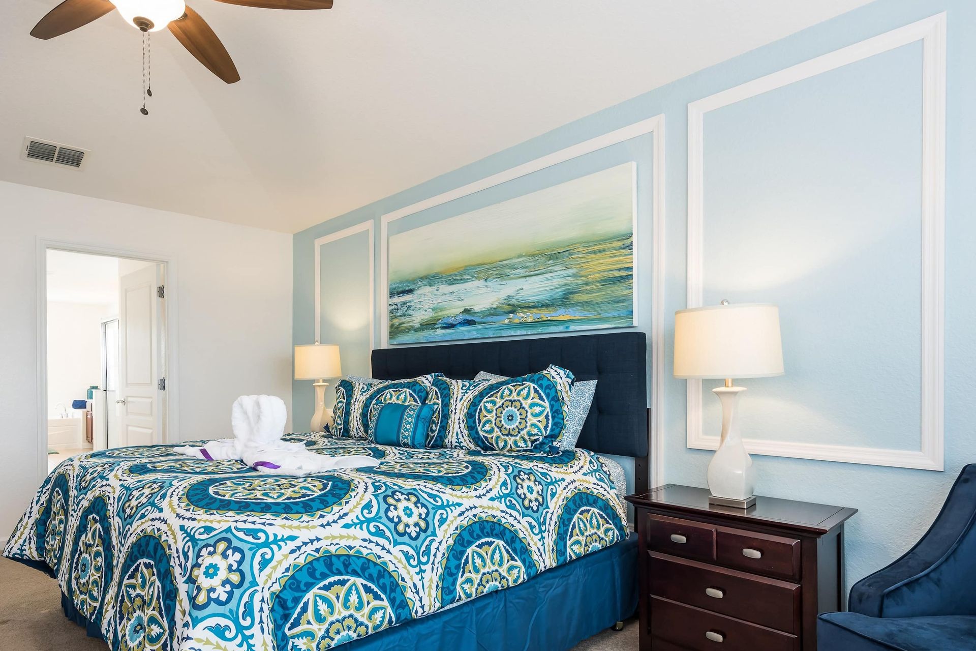 Elegant master bedroom with a plush king bed, stylish decor, and a calming ambiance.