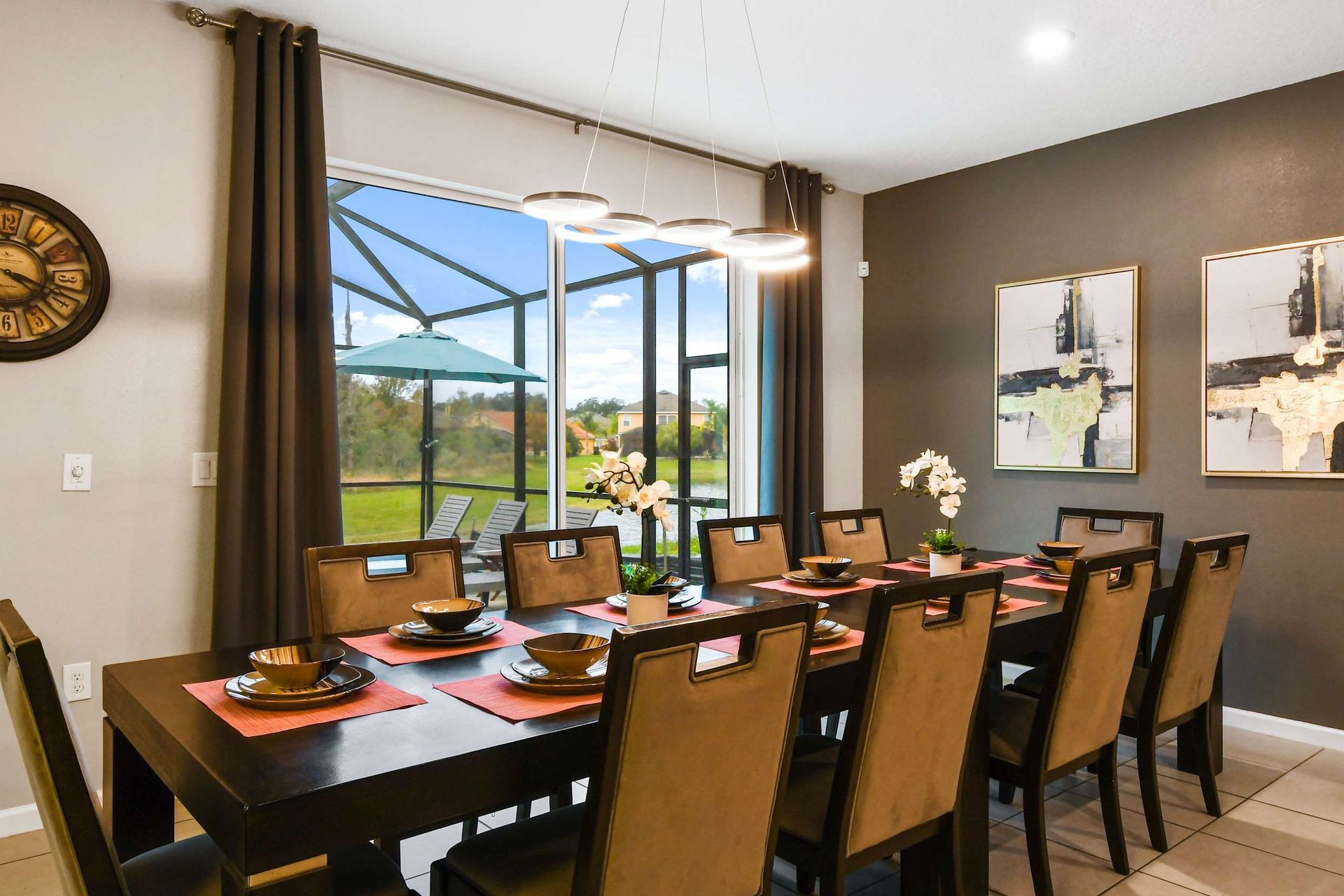 Elegant dining area with seating for 10, modern decor, and beautiful outdoor views.