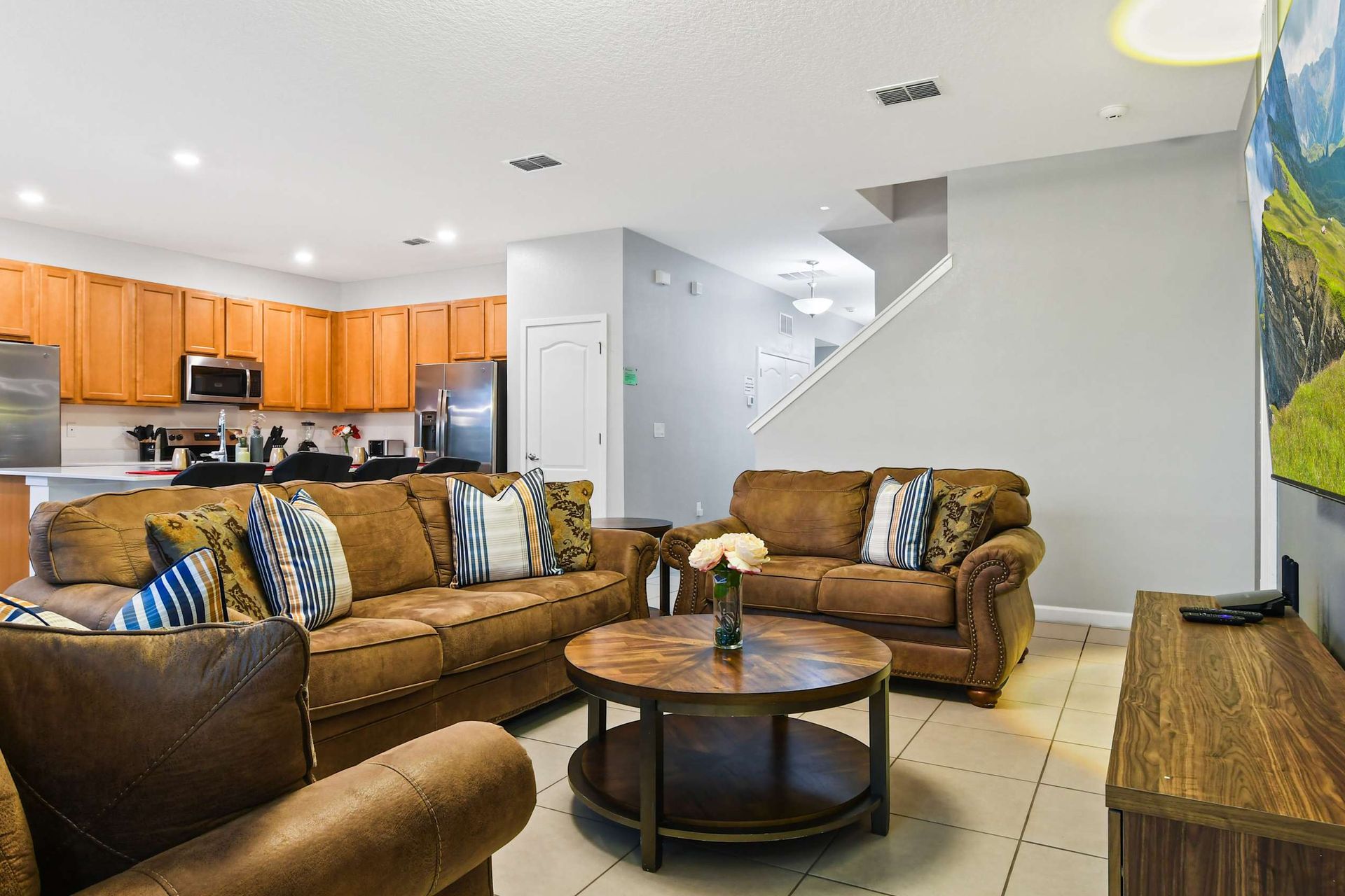Cozy up in this stylish open-concept living area, perfect for relaxing and entertaining.