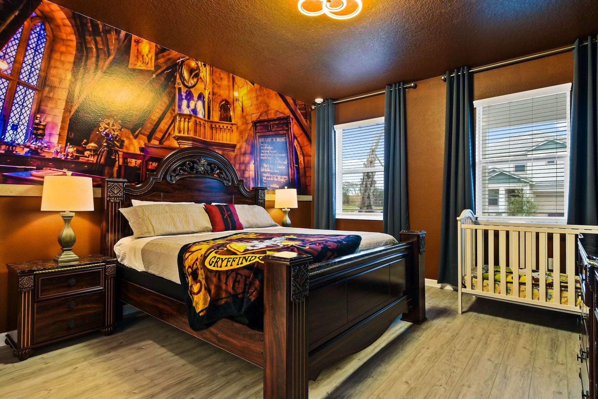 Harry Potter themed King bedroom with crib, ready for bedtime stories.