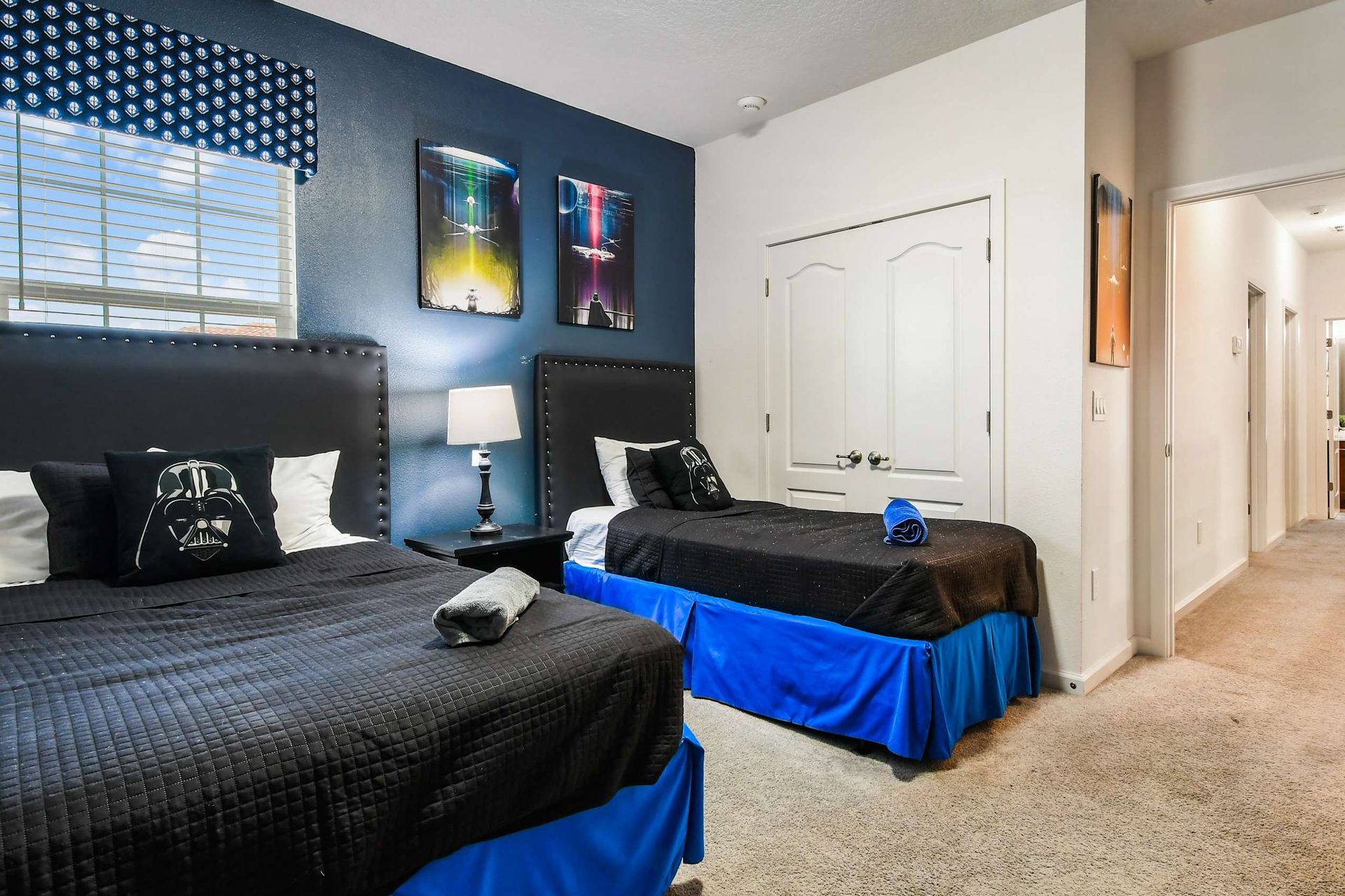 Star Wars-themed twin bedroom with stylish decor, cozy beds, and a fun galactic vibe.