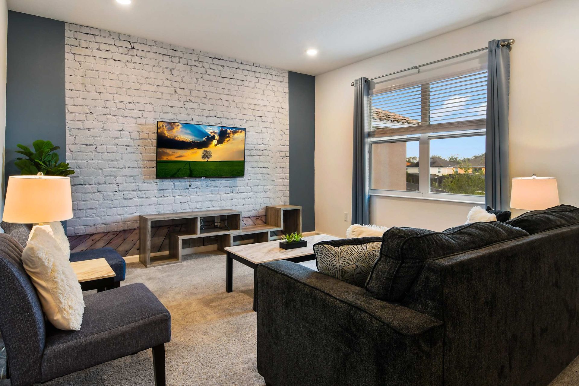 Chic living space with a cozy vibe, stylish decor, and a smart TV for relaxation.