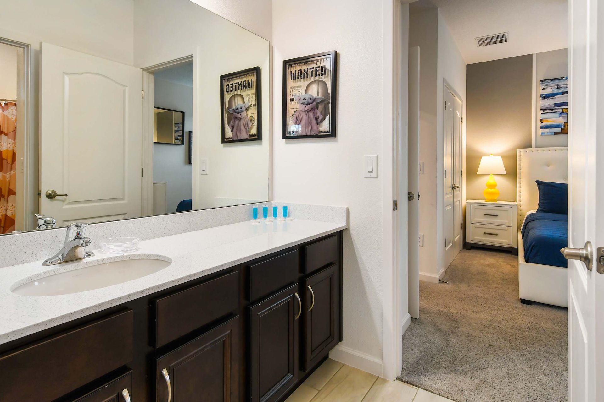 Elegant bathroom with dual sinks, walk-in shower, and modern lighting. Relax here!