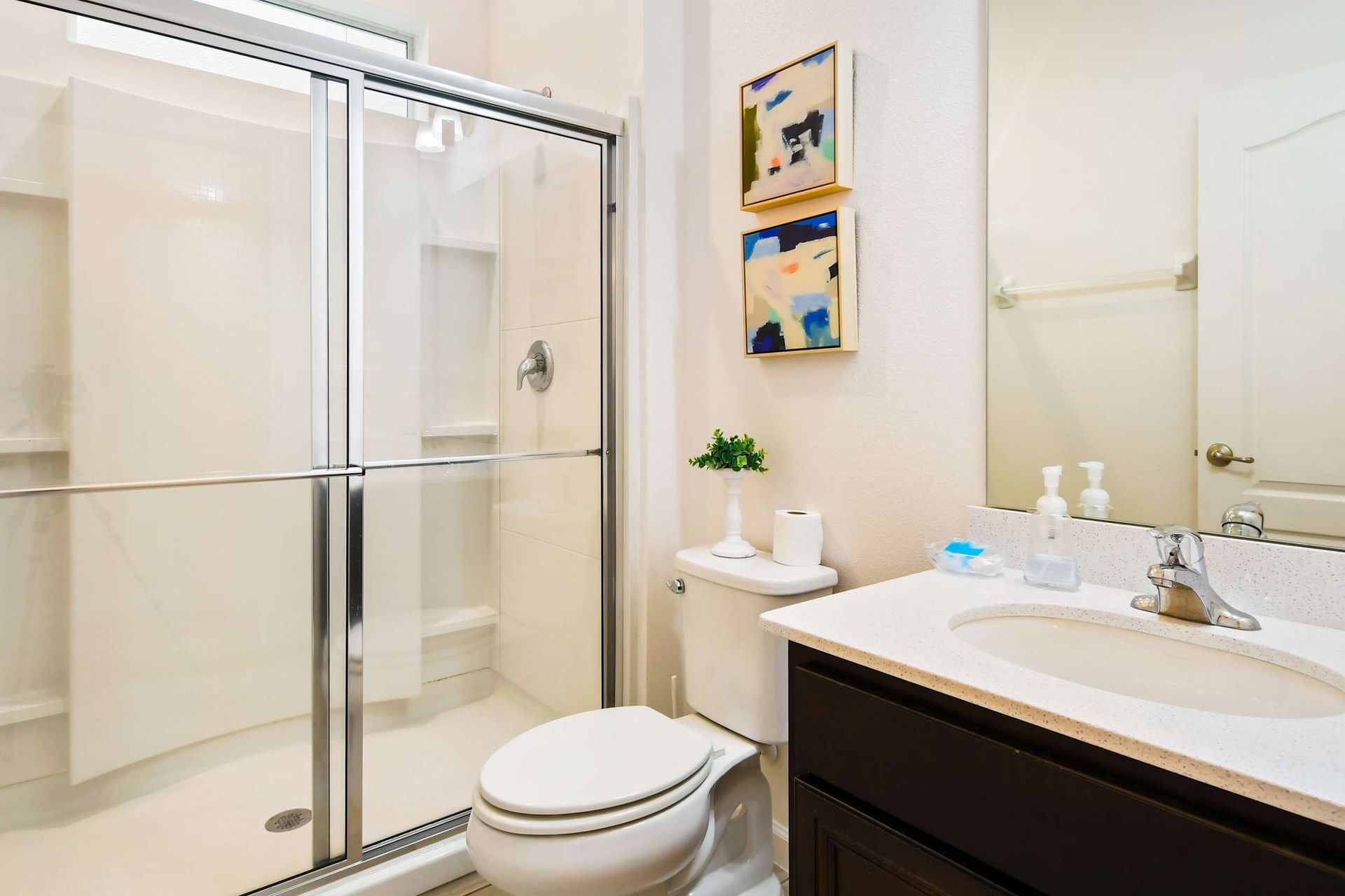 Bright coastal-themed bathroom with a tub, perfect for a relaxing getaway!